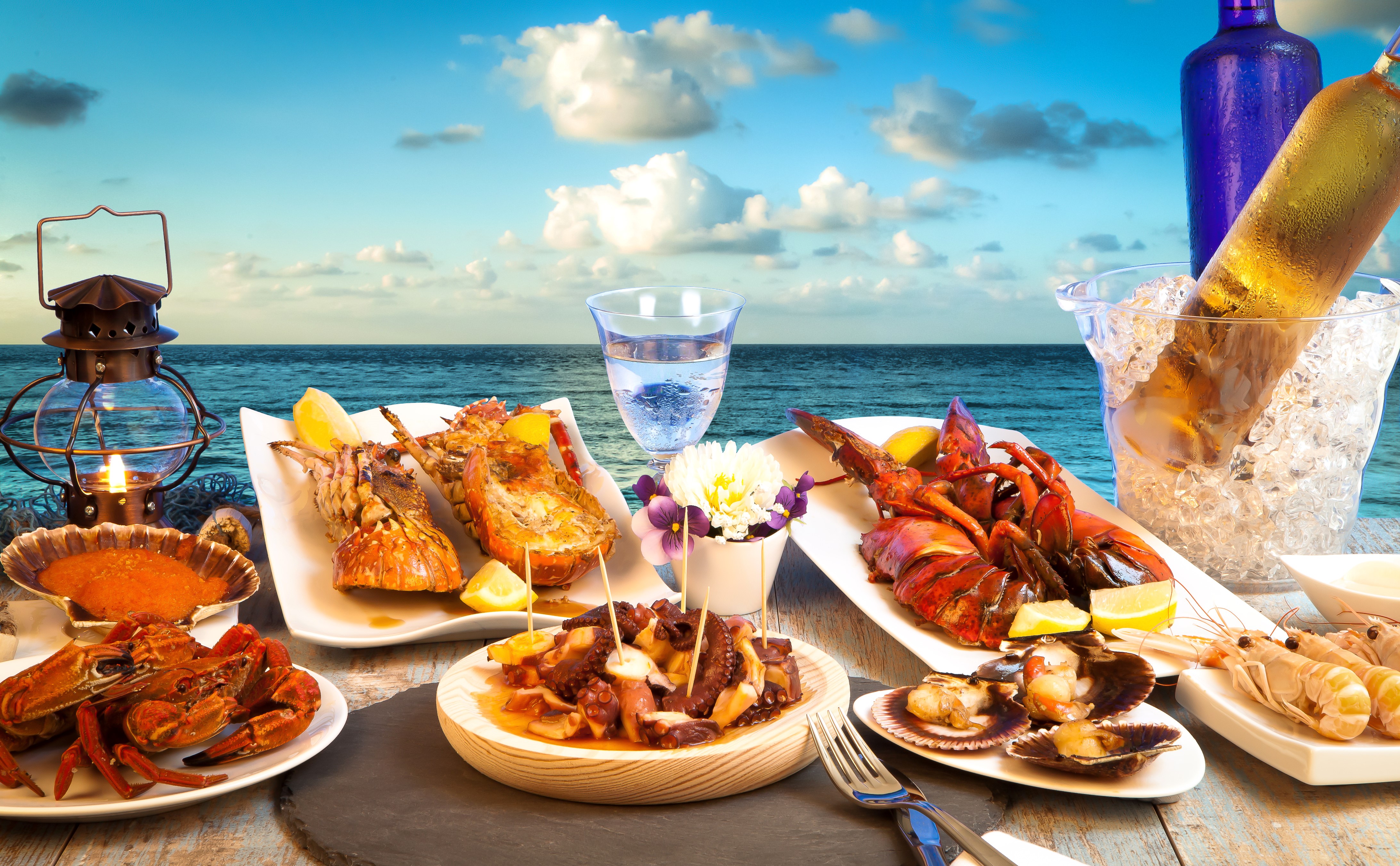 Seafood feast with lobsters and crab by the ocean HD Wallpaper