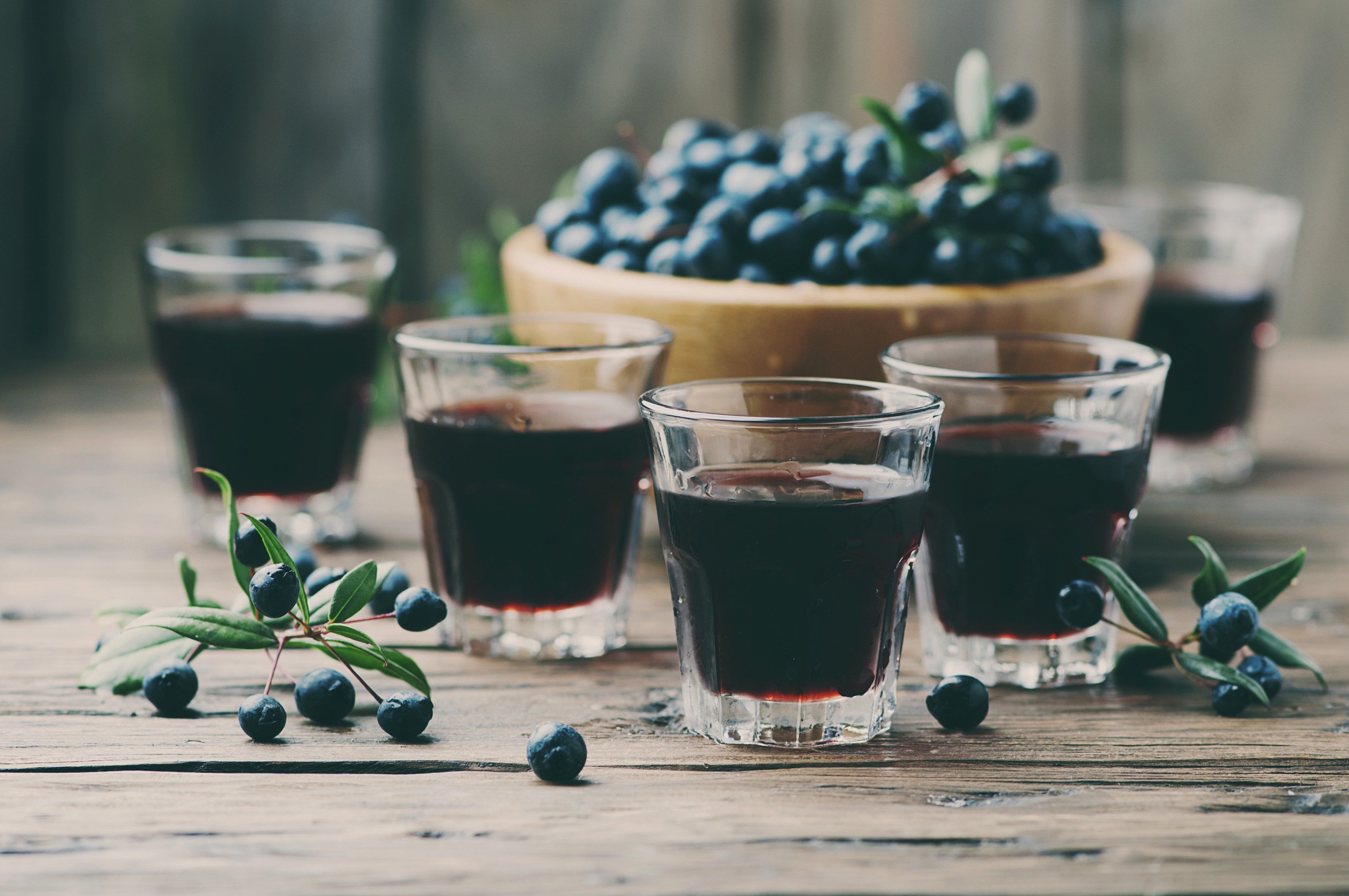 Blueberry liqueur shots with fresh berries HD Wallpaper