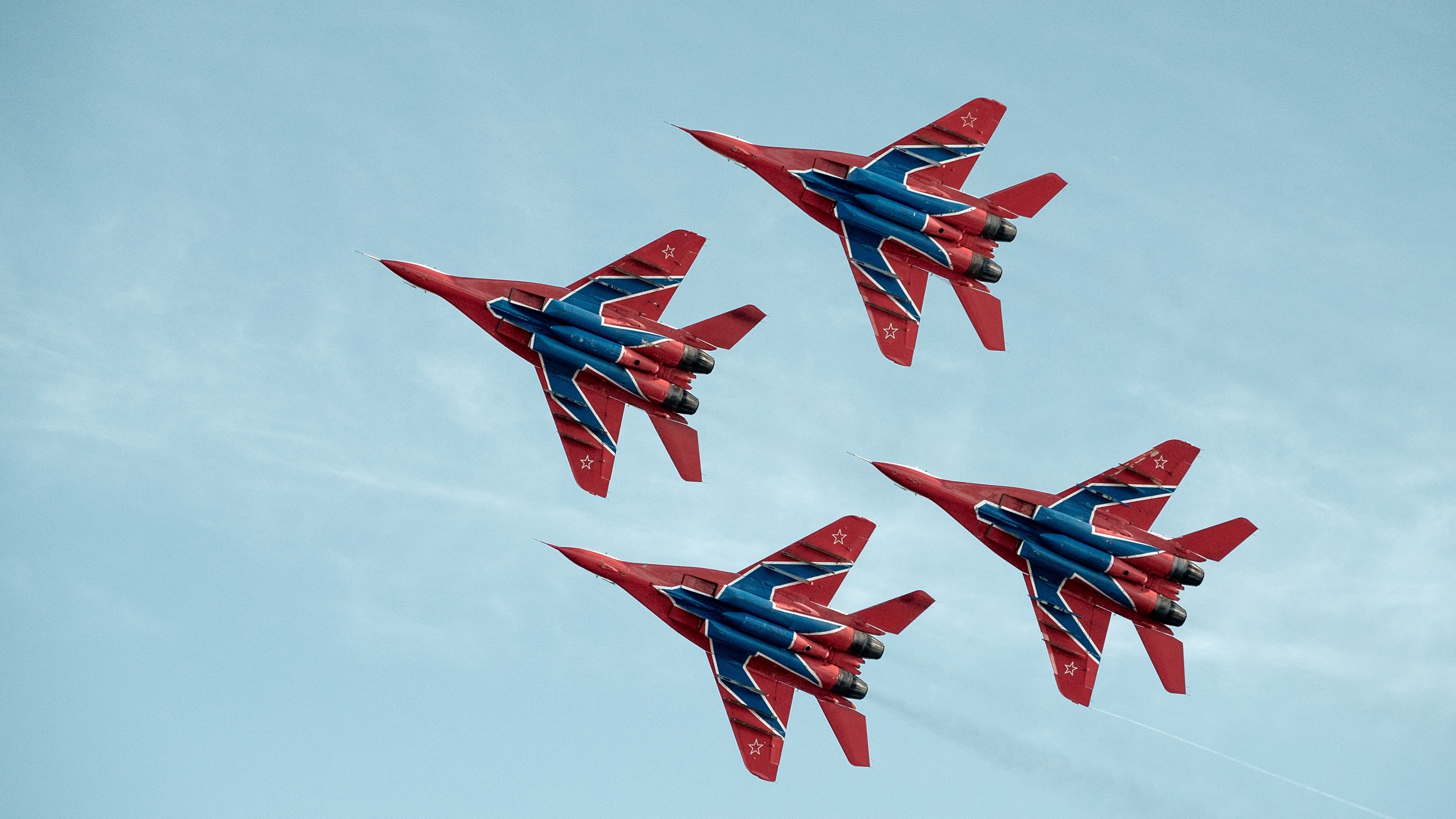 Four Mikoyan MiG-29 fighter jets in formation HD Wallpaper