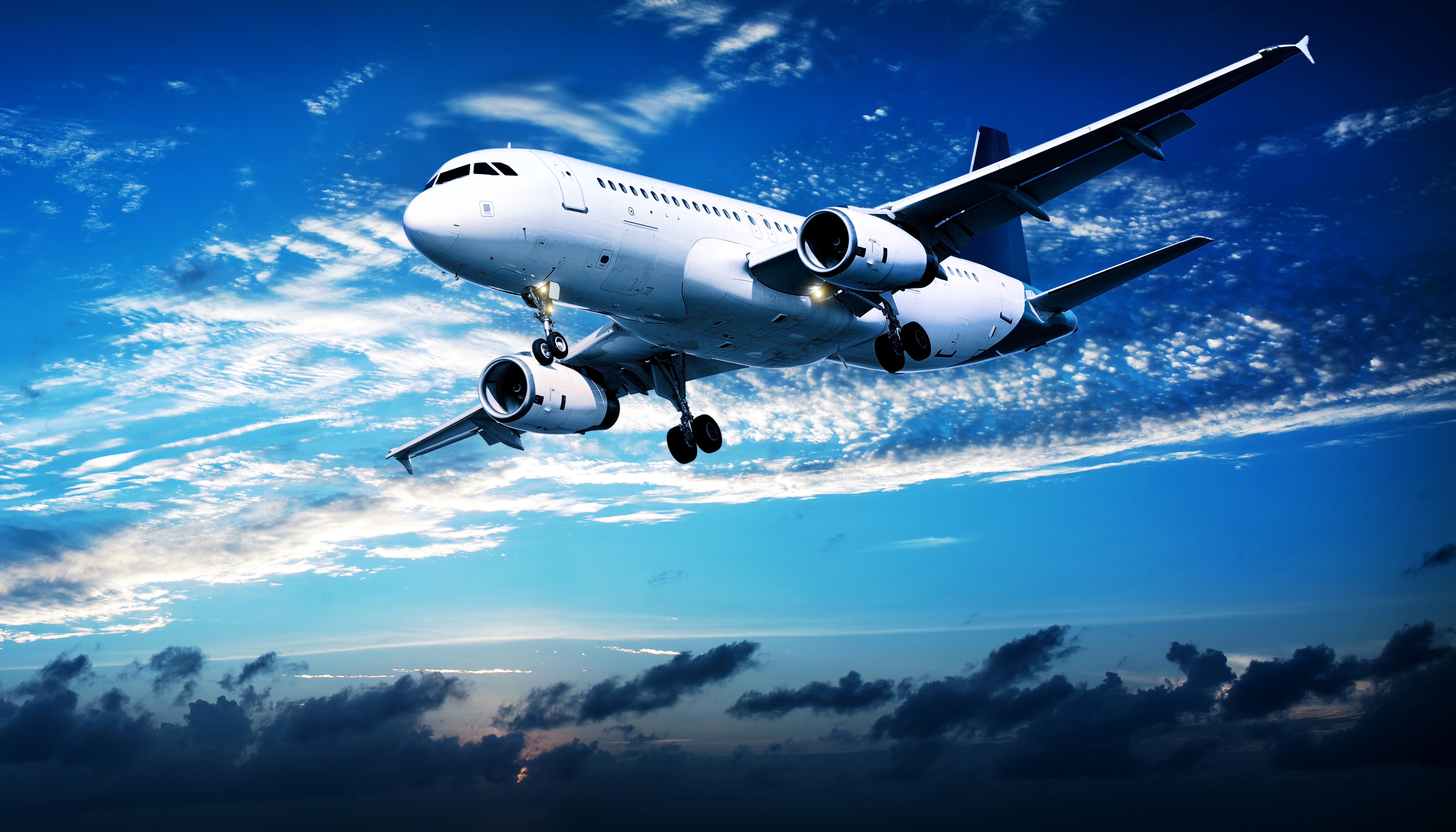 Airplane flying in the sky with clouds HD Wallpaper