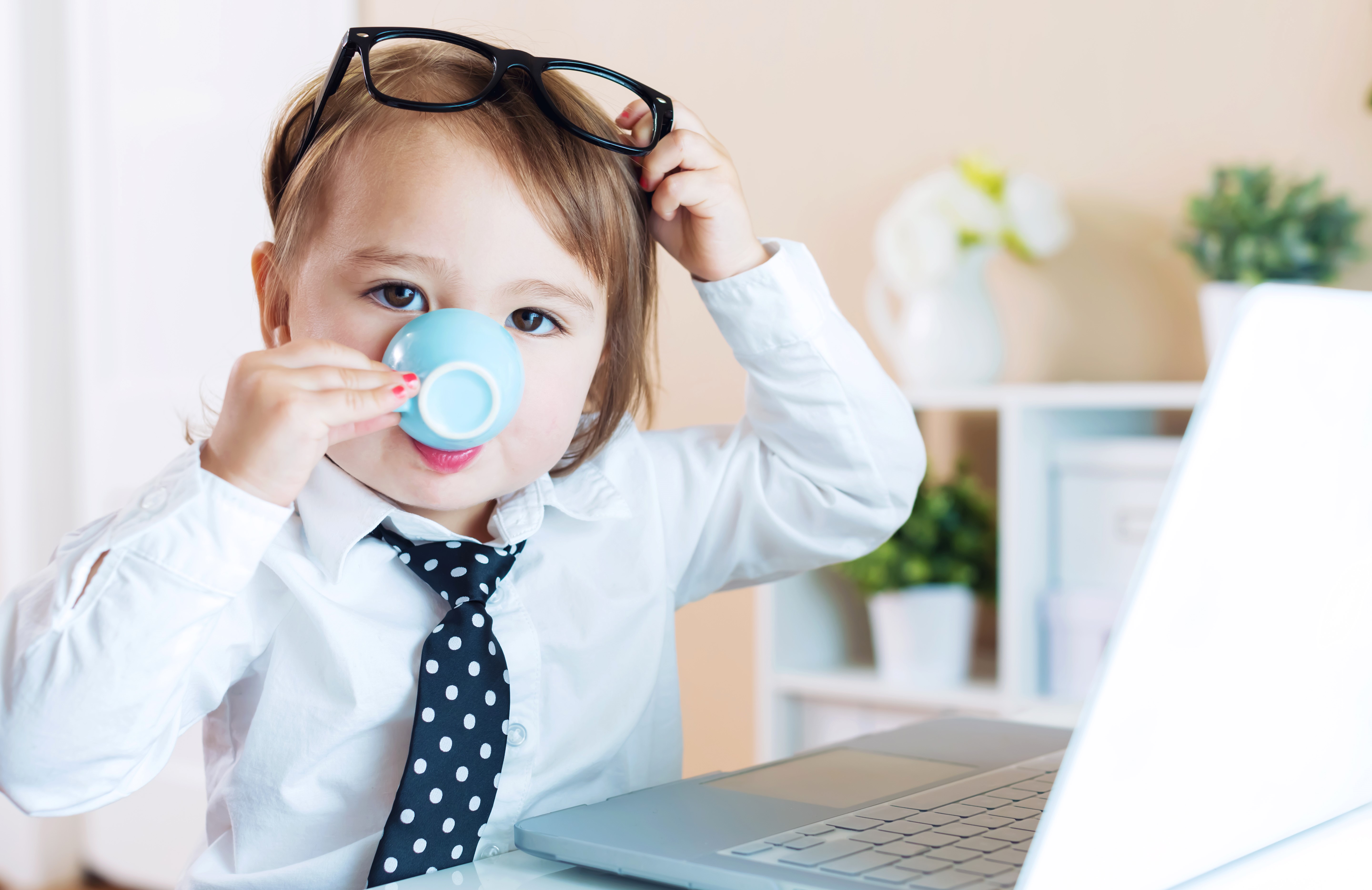 Child in Glasses and Necktie Drinking from Cup HD Wallpaper
