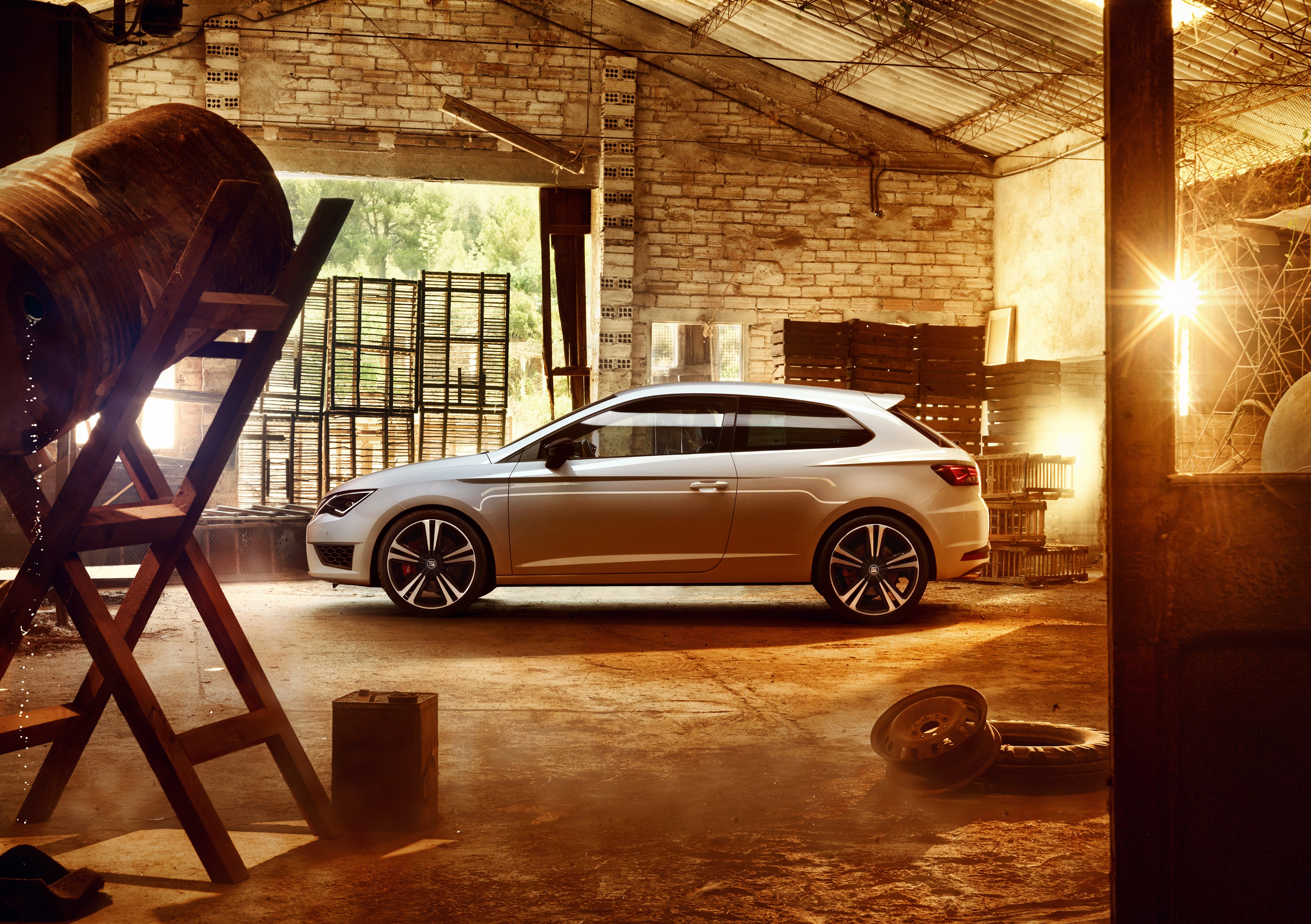 White Seat Leon 2015 in a rustic garage HD Wallpaper
