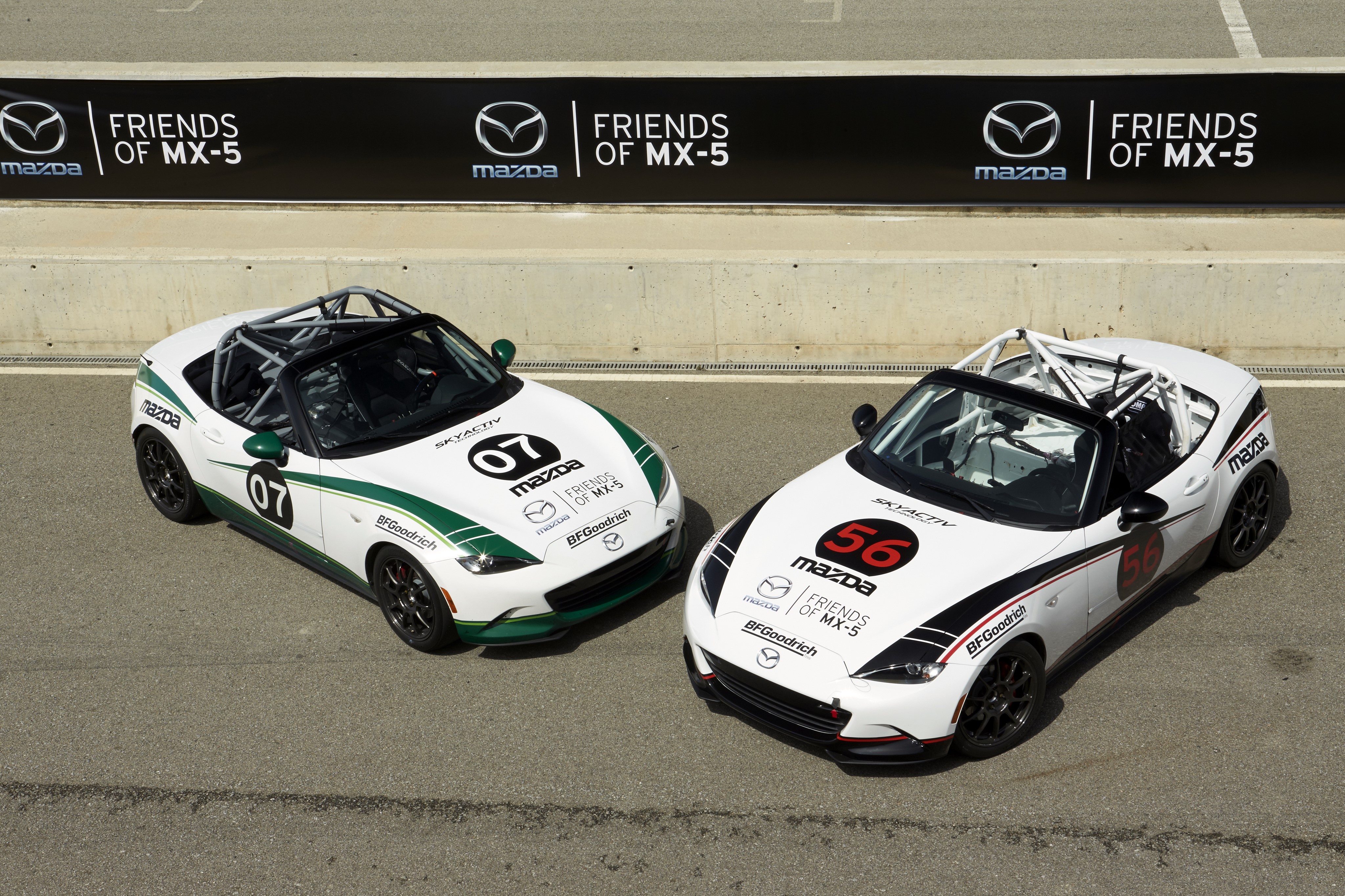 Two Mazda MX-5 Cup cars with racing numbers 07 and 56 HD Wallpaper