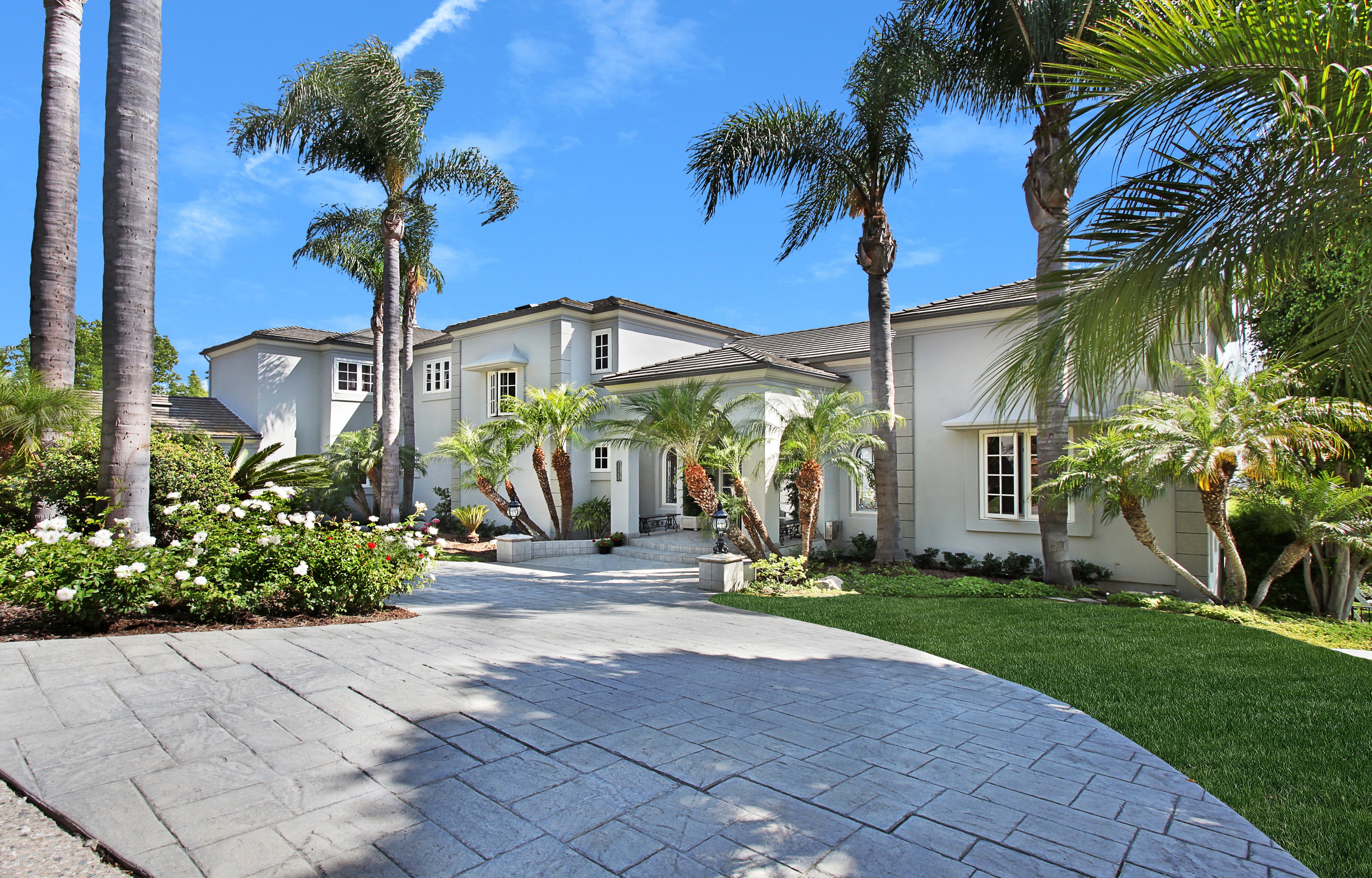 Luxury Mansion with Palm Trees and Stamped Concrete Driveway HD Wallpaper