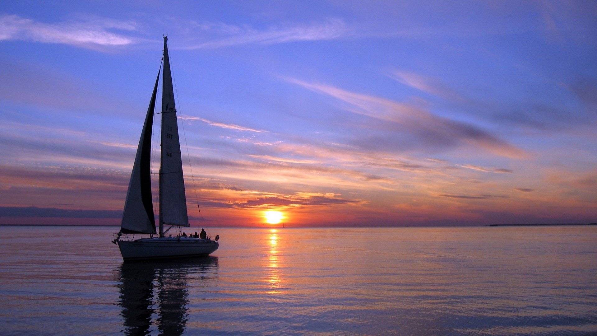 Sailboat on the water at sunset HD Wallpaper