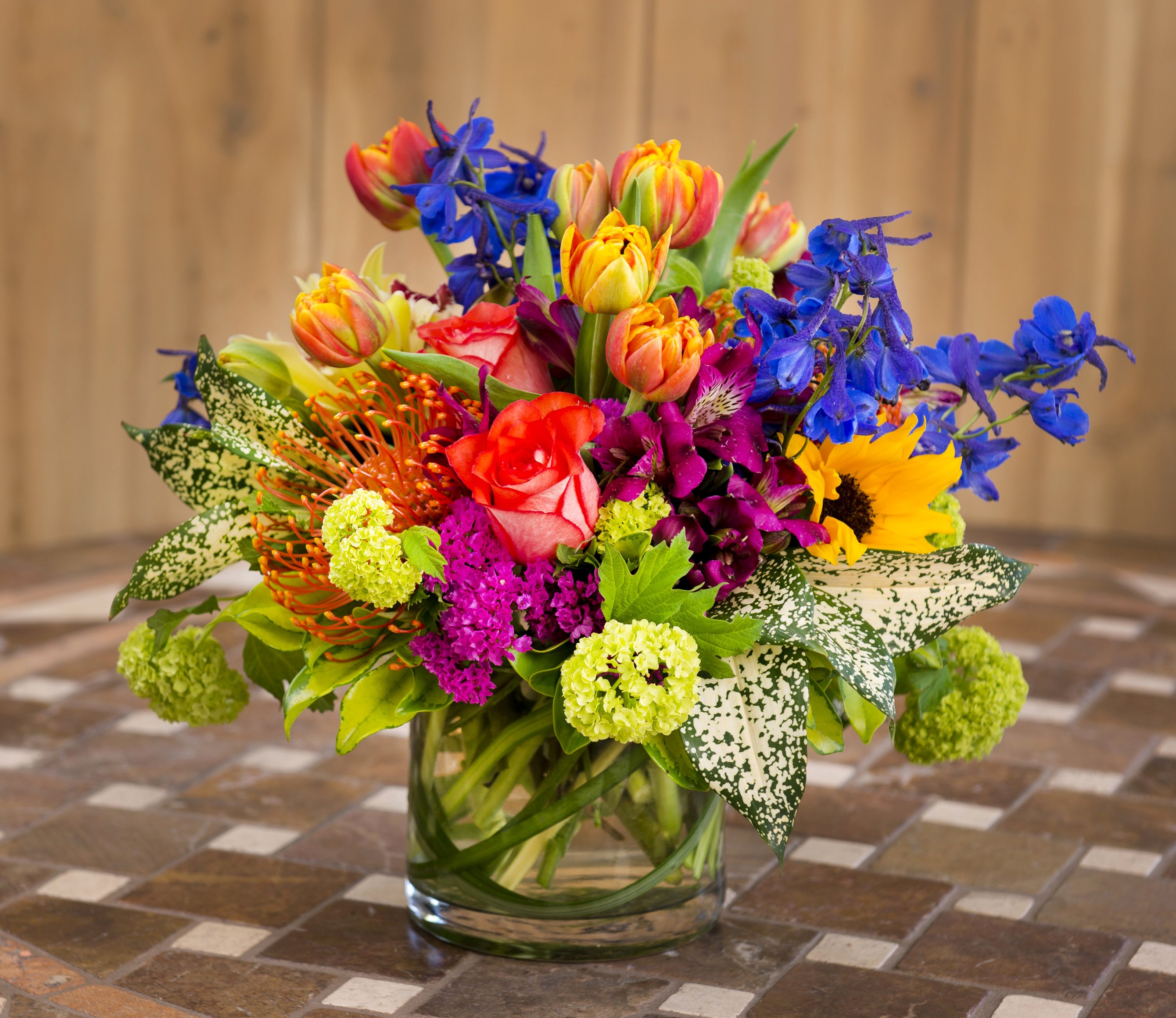 Colorful flower arrangement in a glass vase HD Wallpaper