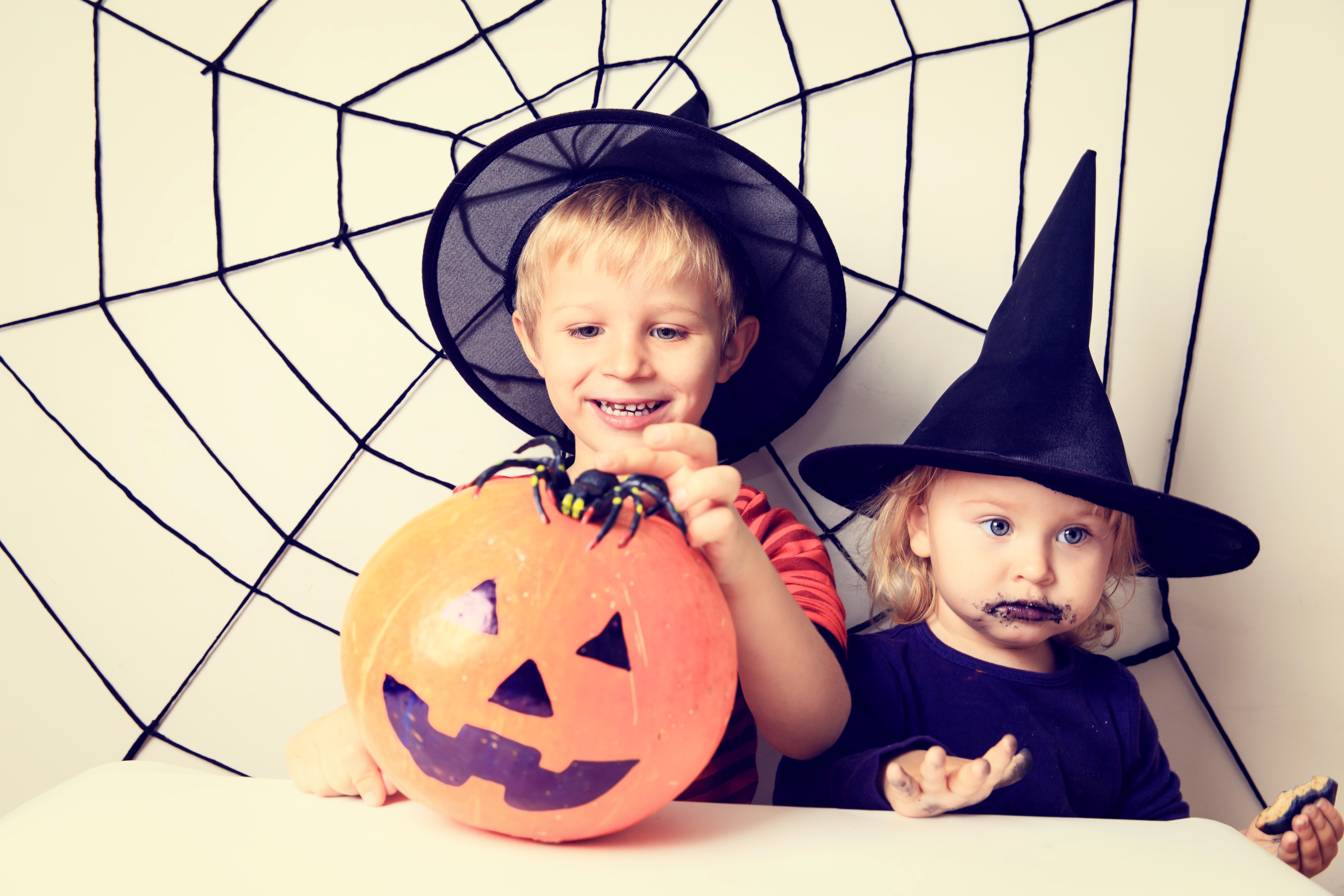 Two children in Halloween costumes with a pumpkin HD Wallpaper