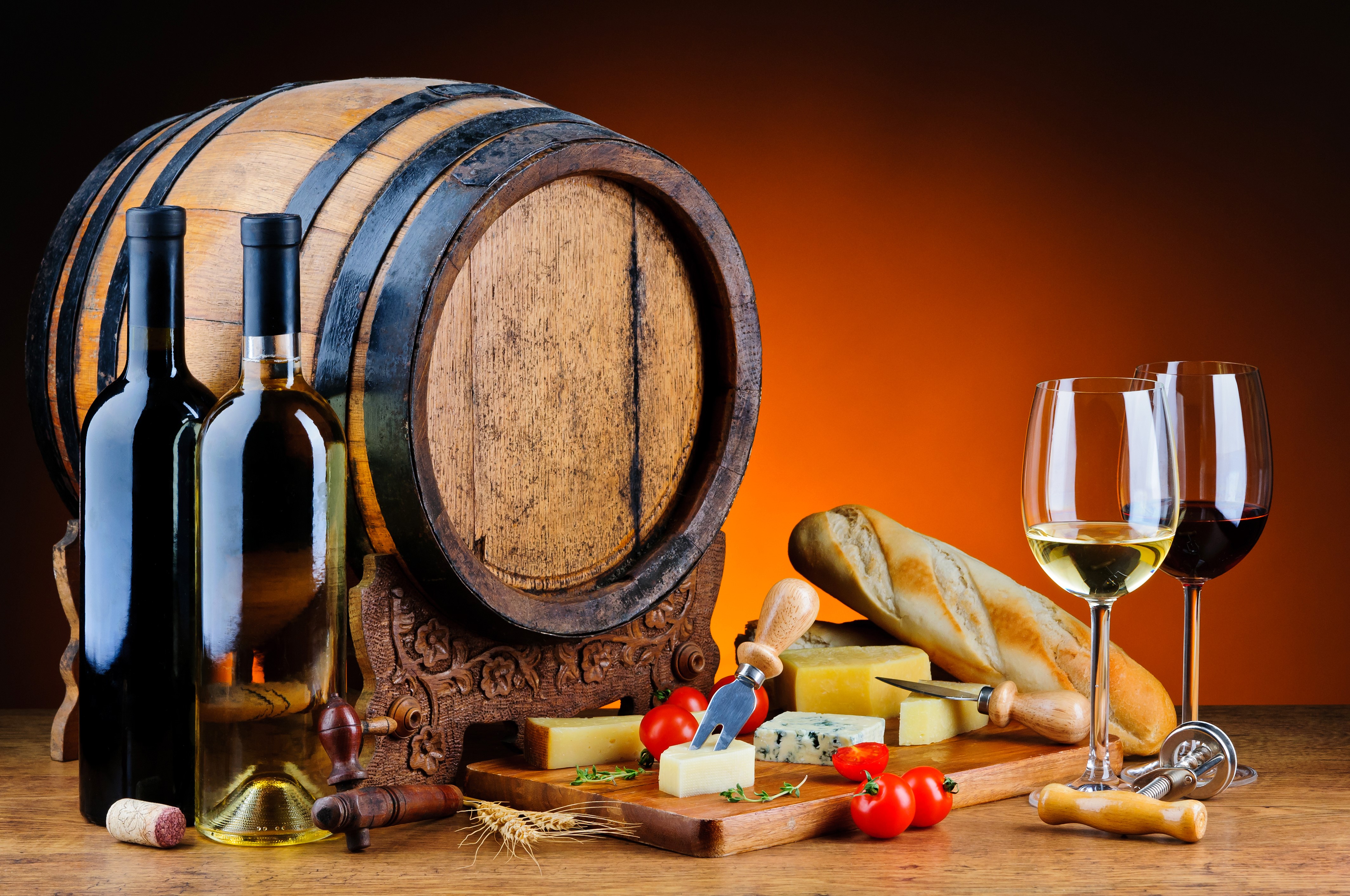 Still-life with wine barrel, bottles, glasses, bread, cheese, and tomatoes HD Wallpaper