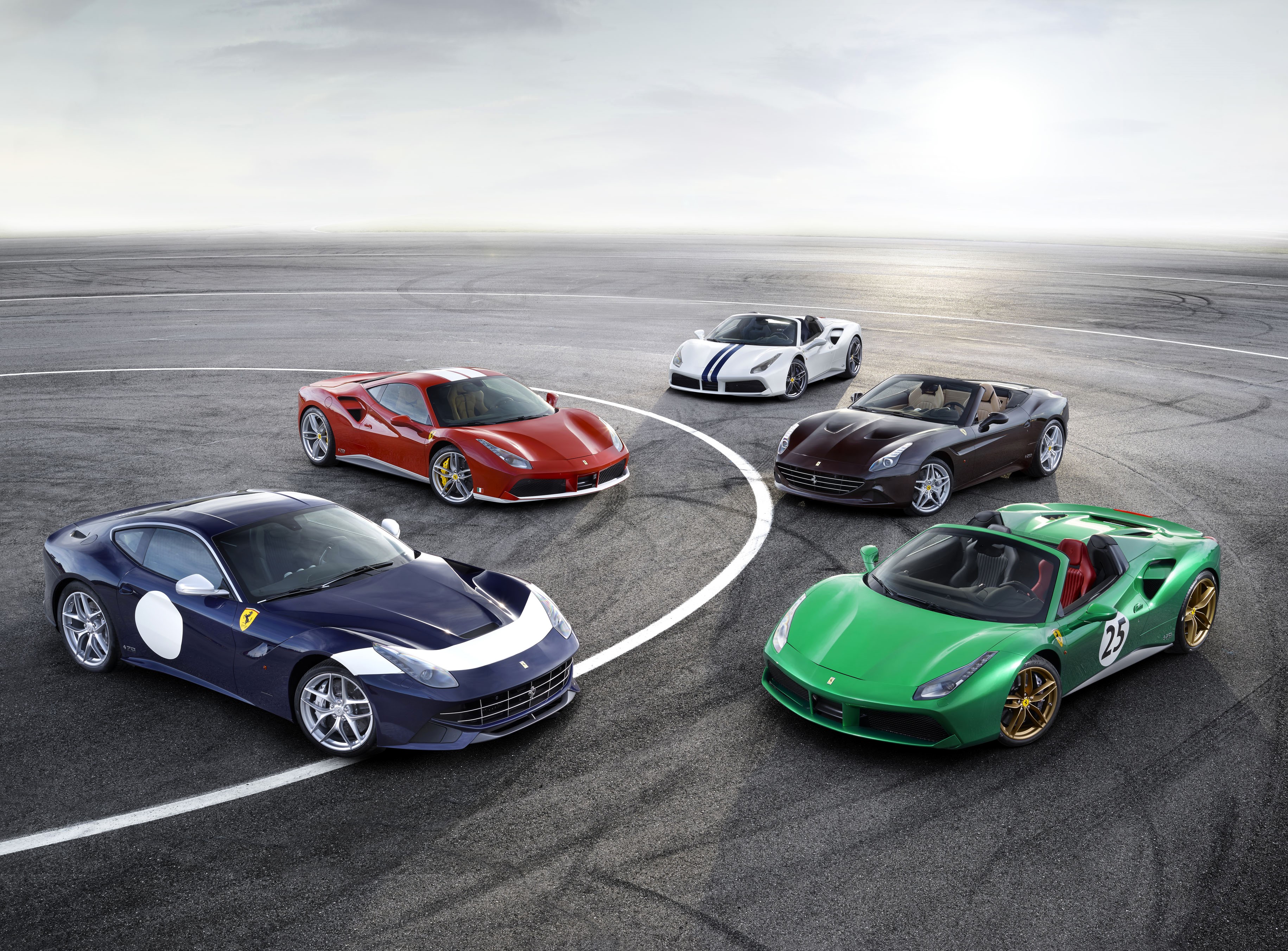 Group of Ferraris on a Racetrack HD Wallpaper