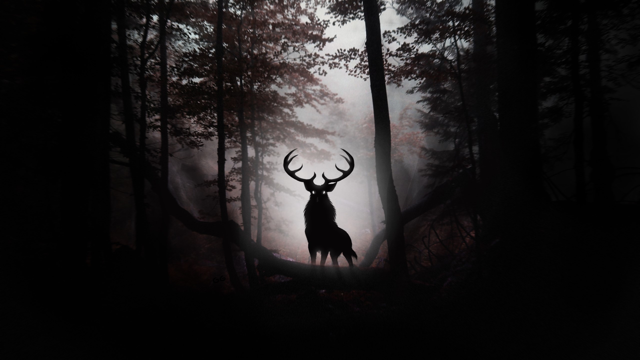 Silhouette of a deer with large antlers in a dark forest HD Wallpaper