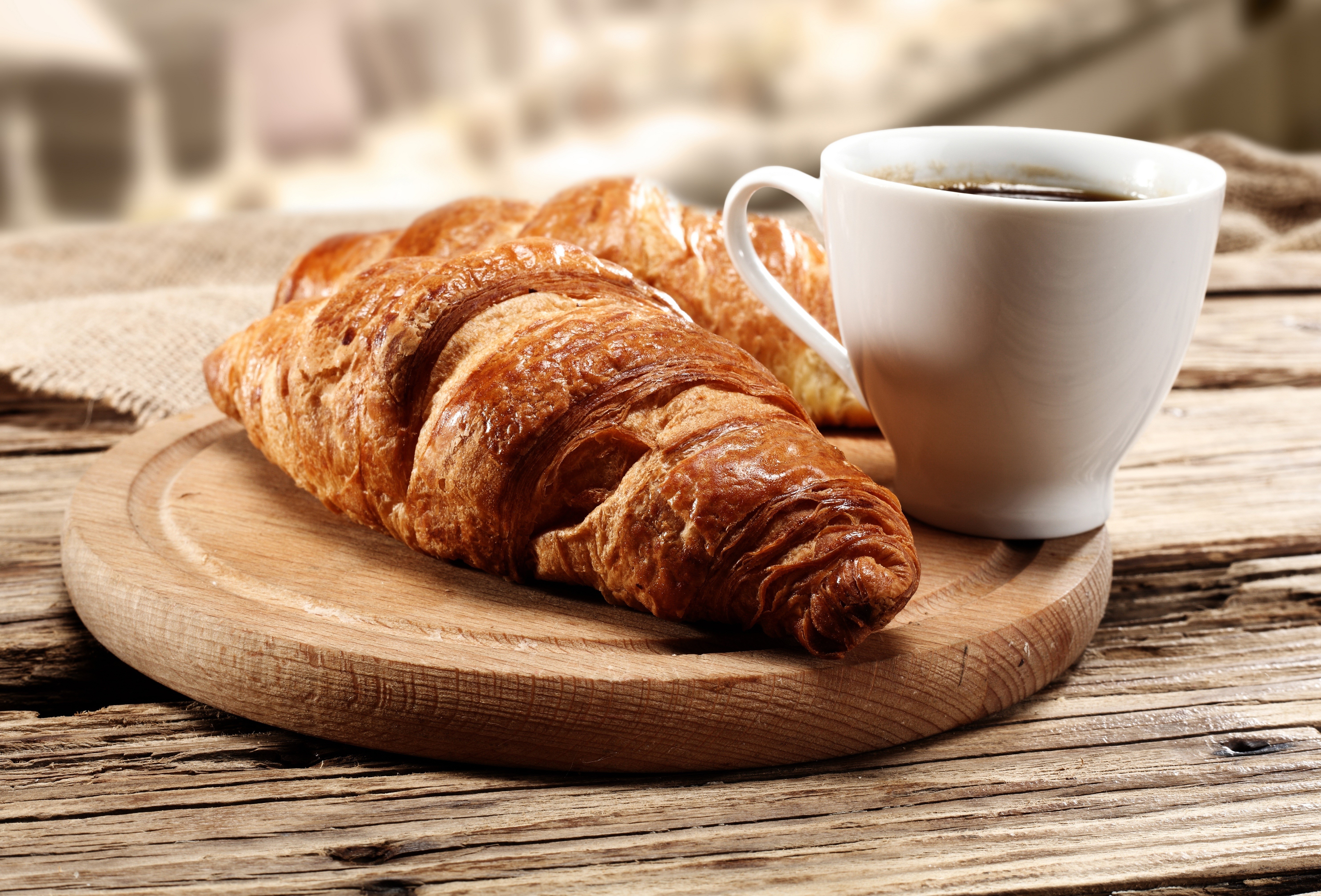 Croissants and coffee on a wooden table HD Wallpaper