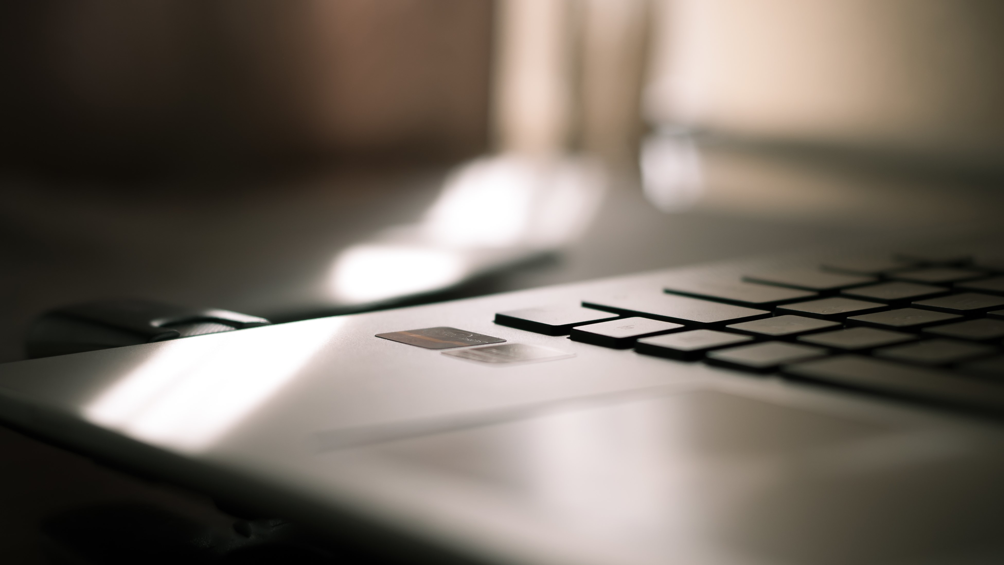 Laptop keyboard and trackpad with cards HD Wallpaper