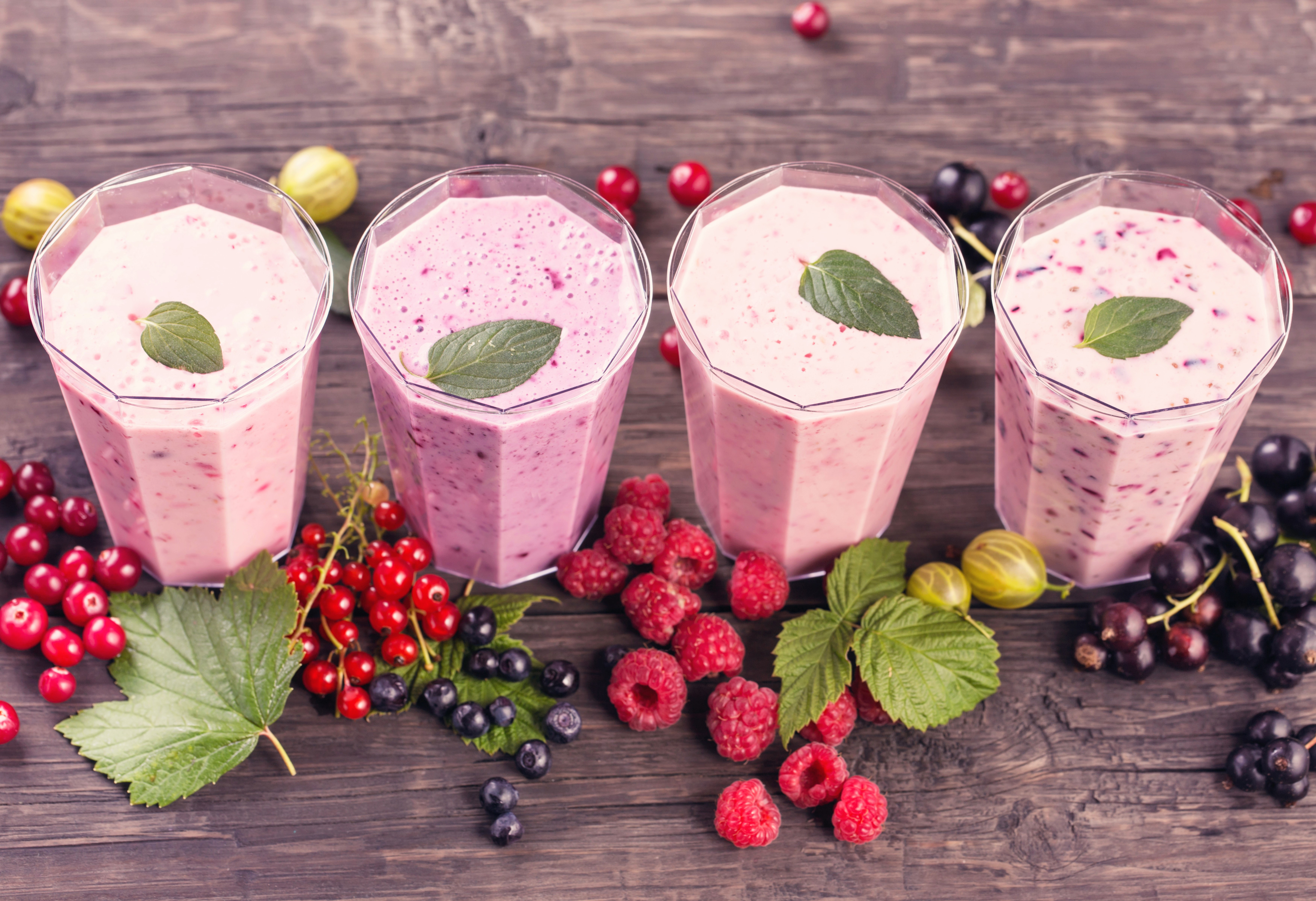 Four berry smoothies with fresh berries HD Wallpaper