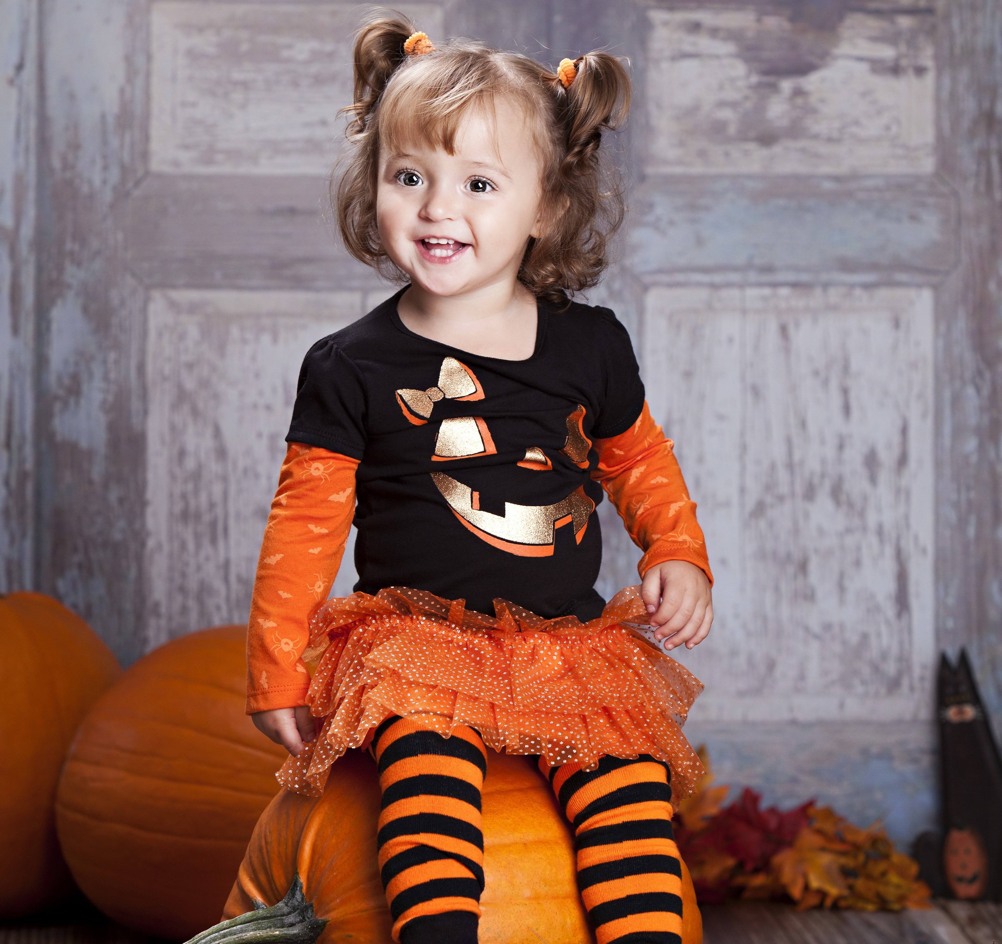 Girl in Halloween Costume Sitting on Pumpkin HD Wallpaper