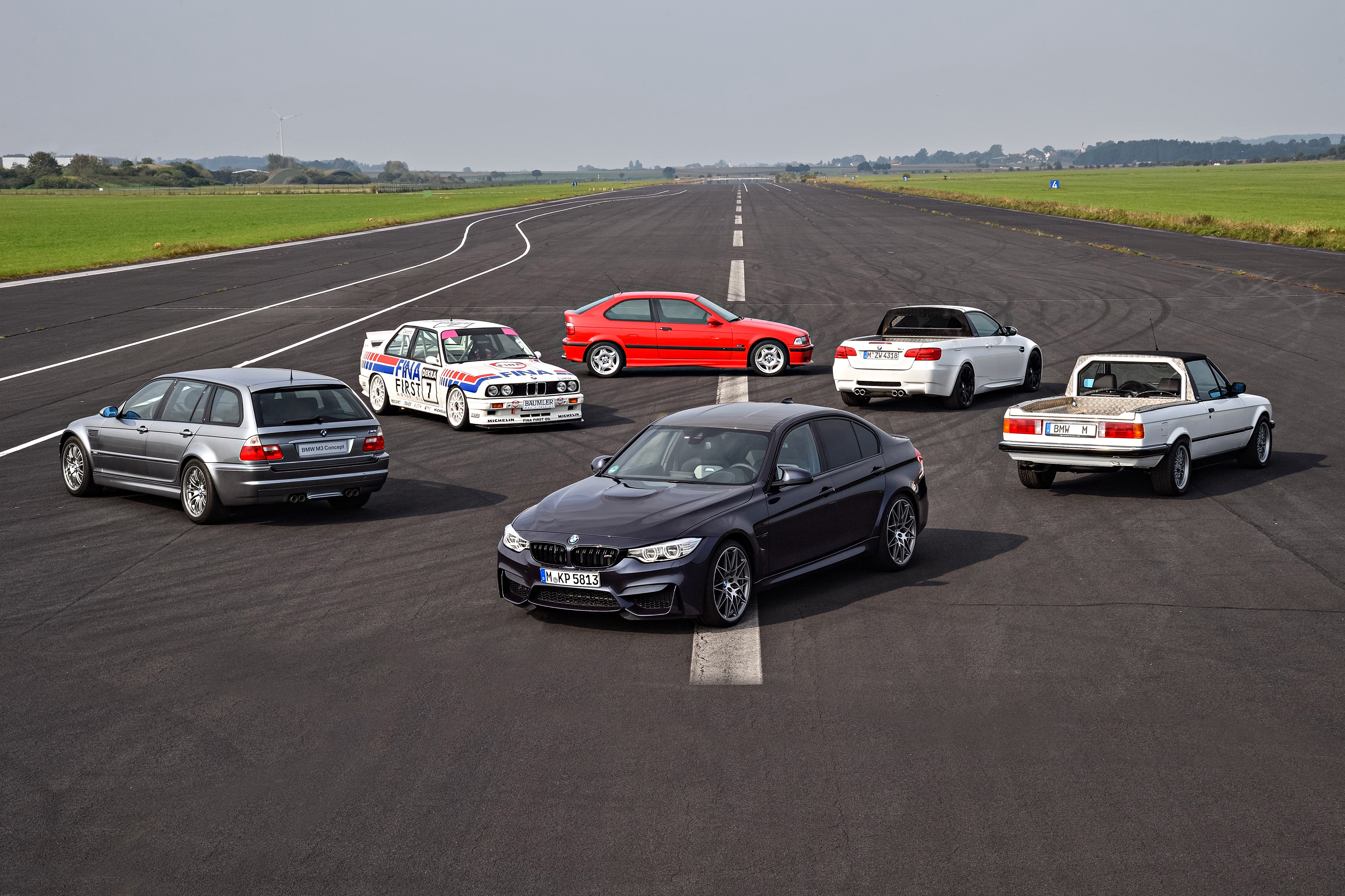 BMW M3 Generations on a Racetrack HD Wallpaper