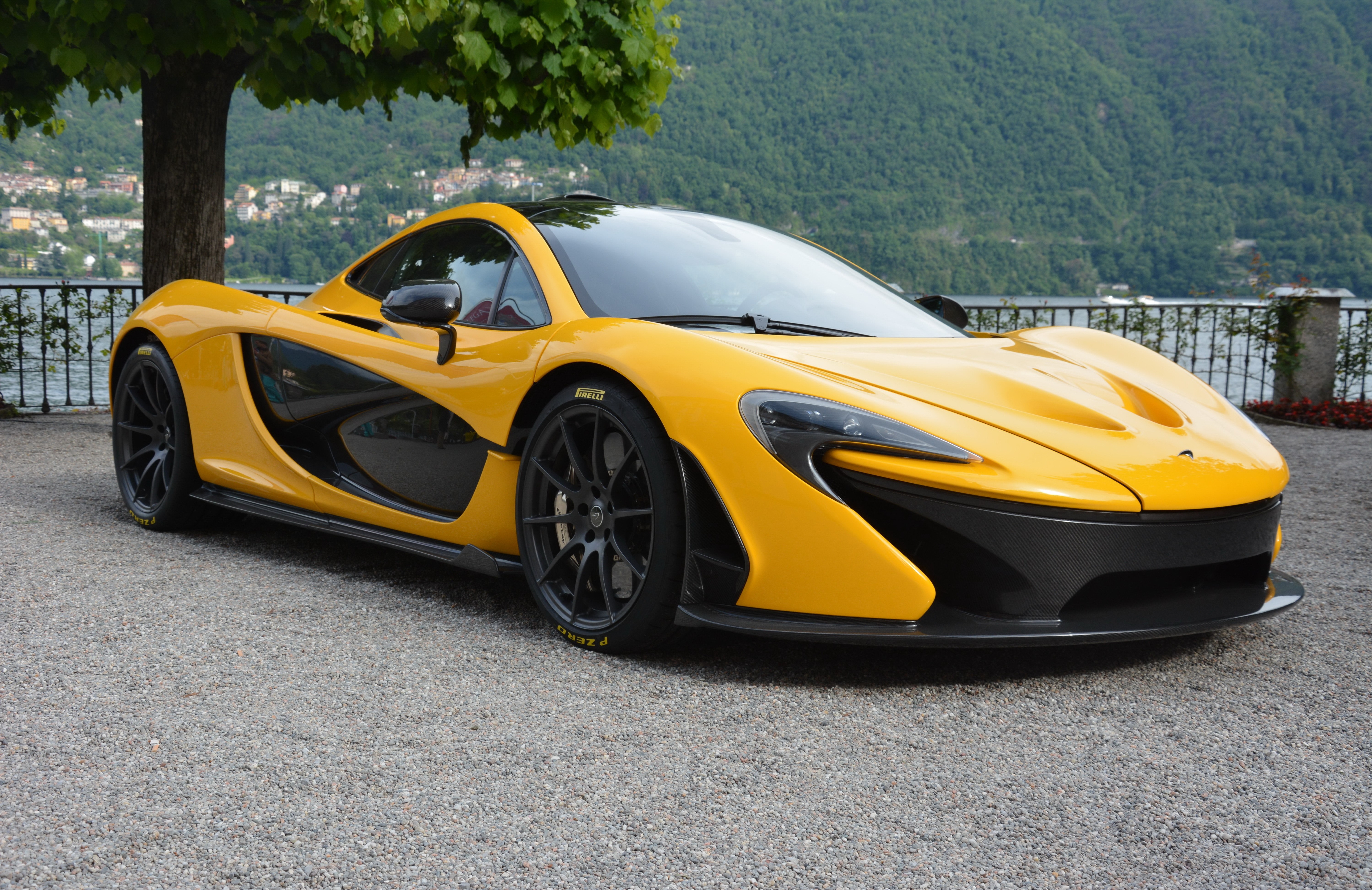 Yellow McLaren P1 on gravel HD Wallpaper