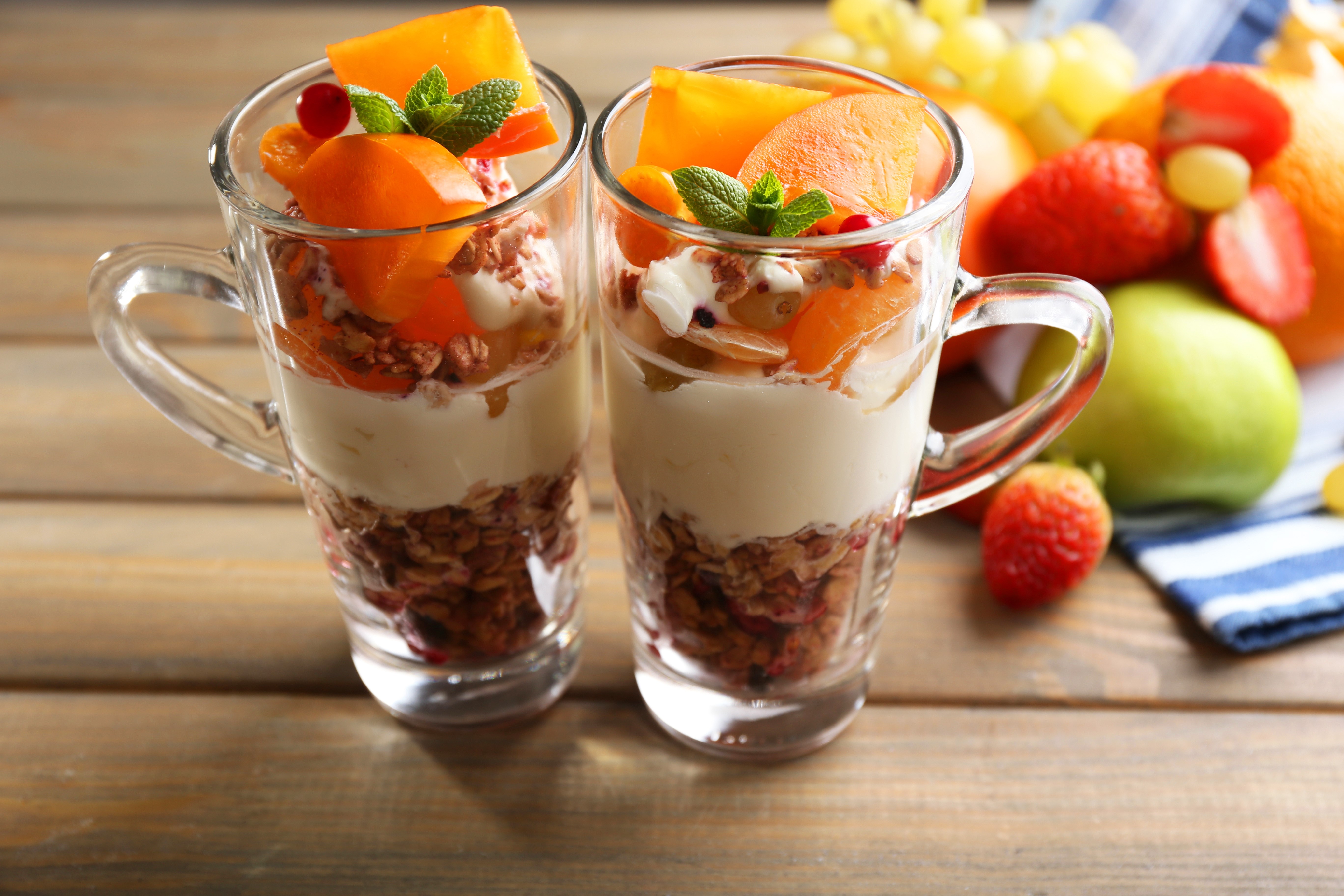 Muesli and fruit parfait in mugs HD Wallpaper