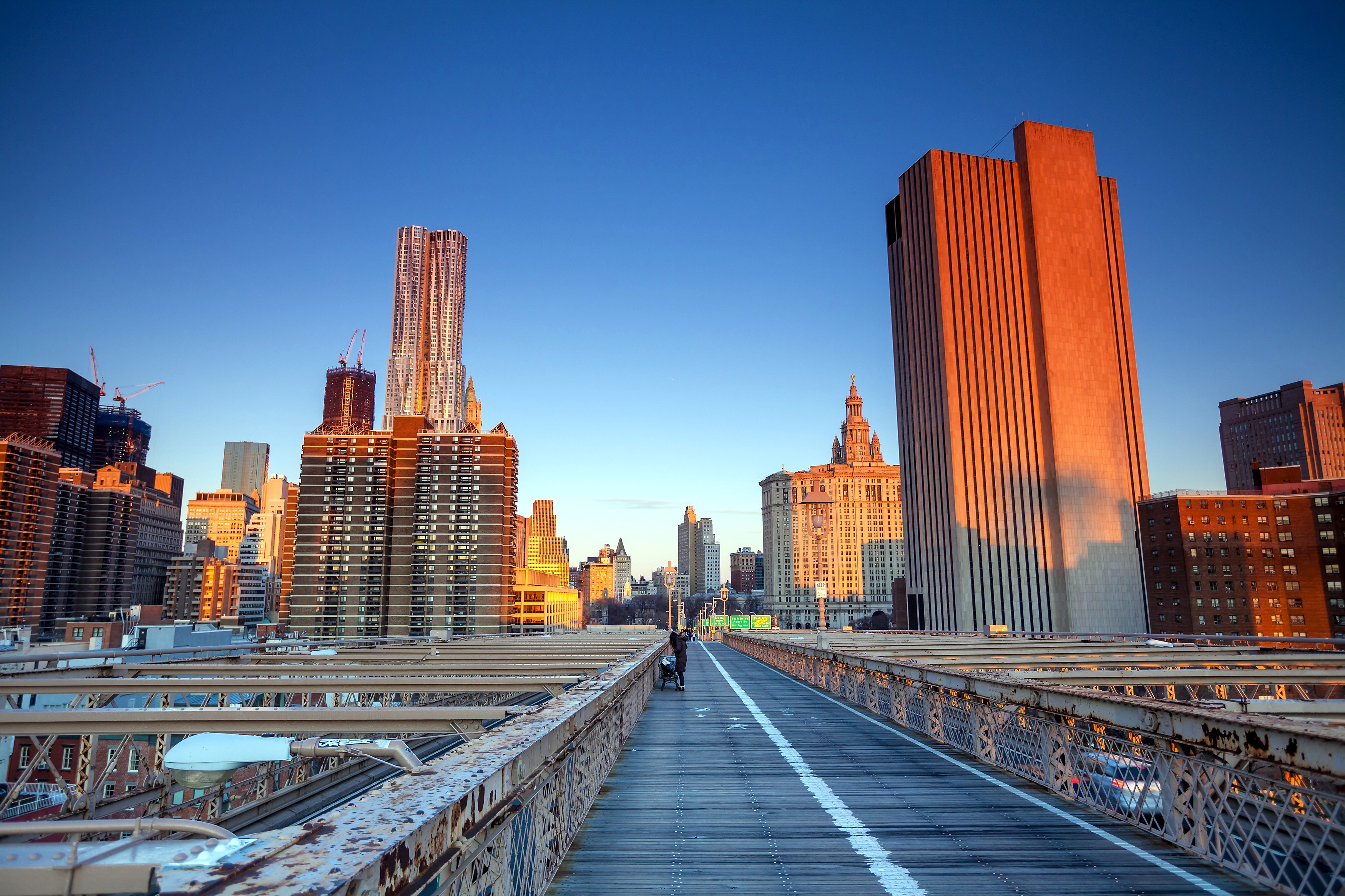 New York City skyline viewed from Brooklyn Bridge at sunset HD Wallpaper