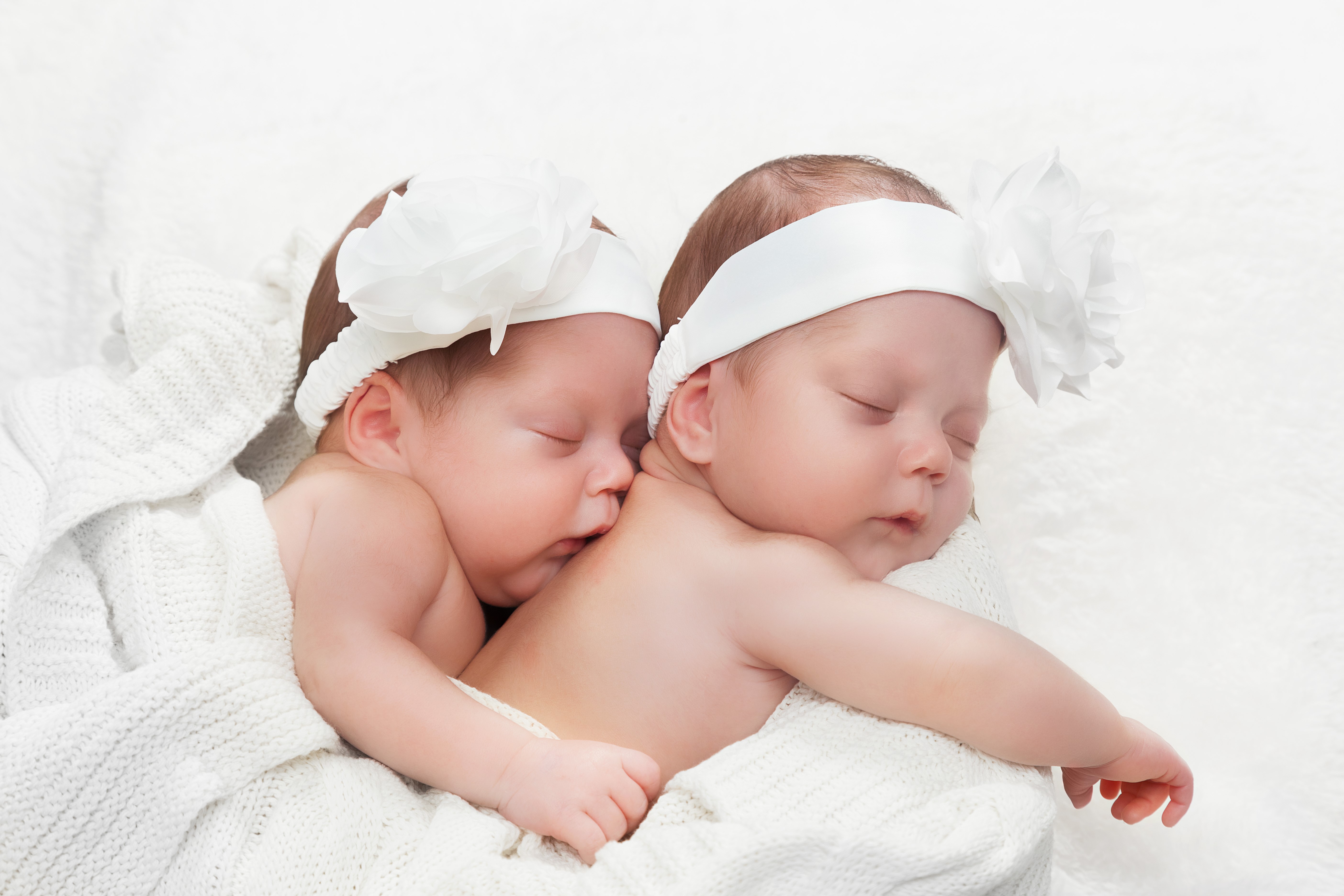 Two Sleeping Infants with White Headbands HD Wallpaper