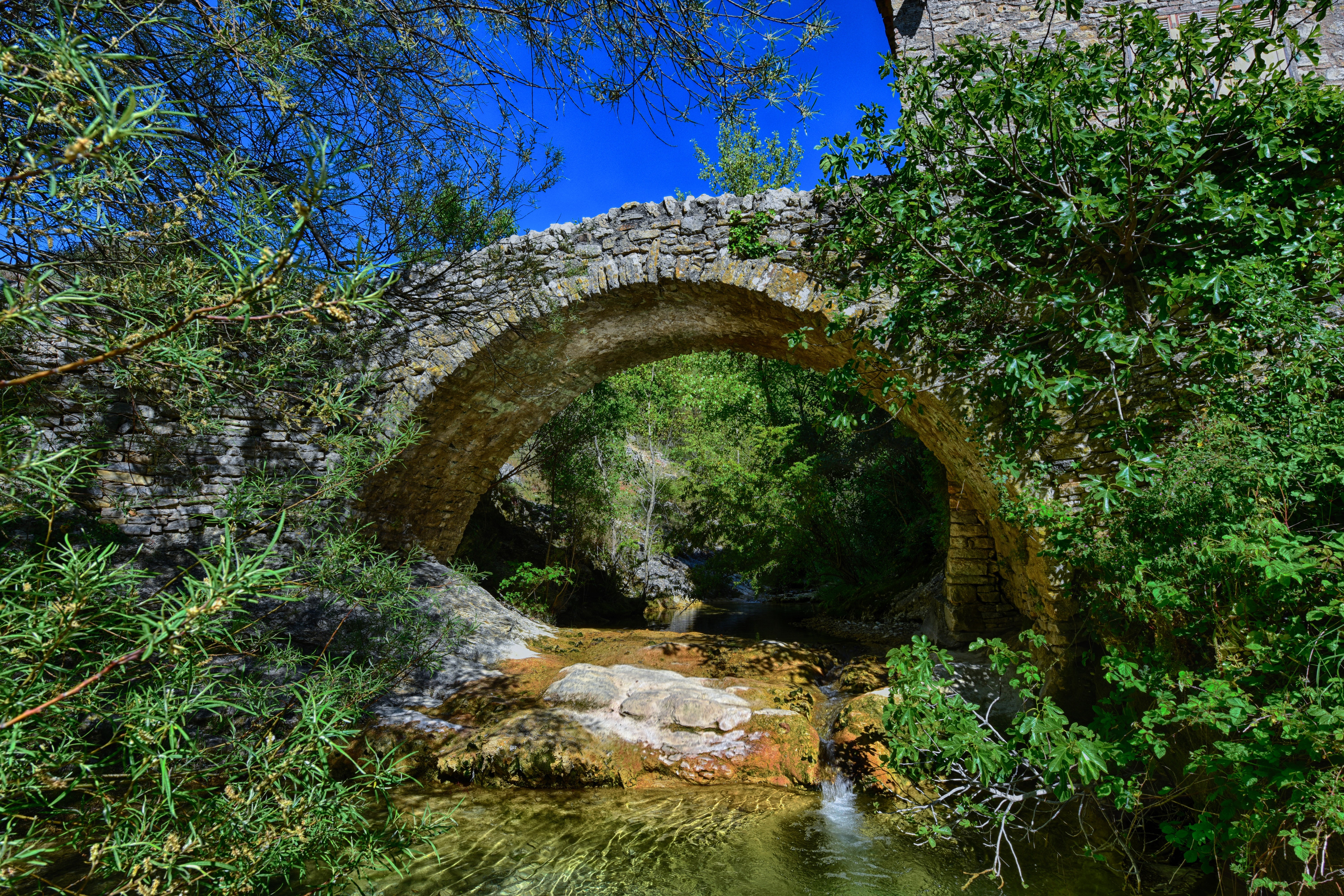 Stone bridge over a river in Rochecolombe, France HD Wallpaper