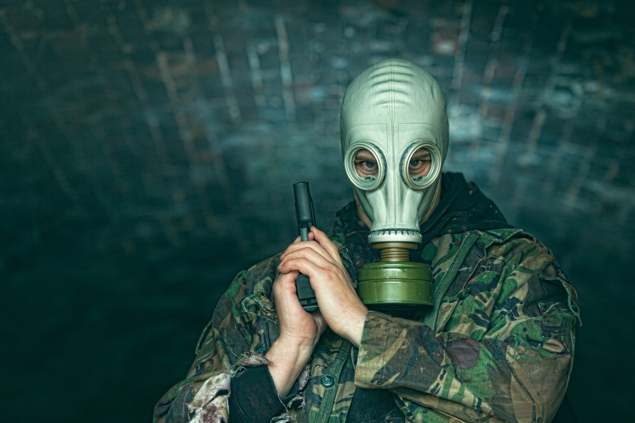 Man in gas mask holding a pistol HD Wallpaper