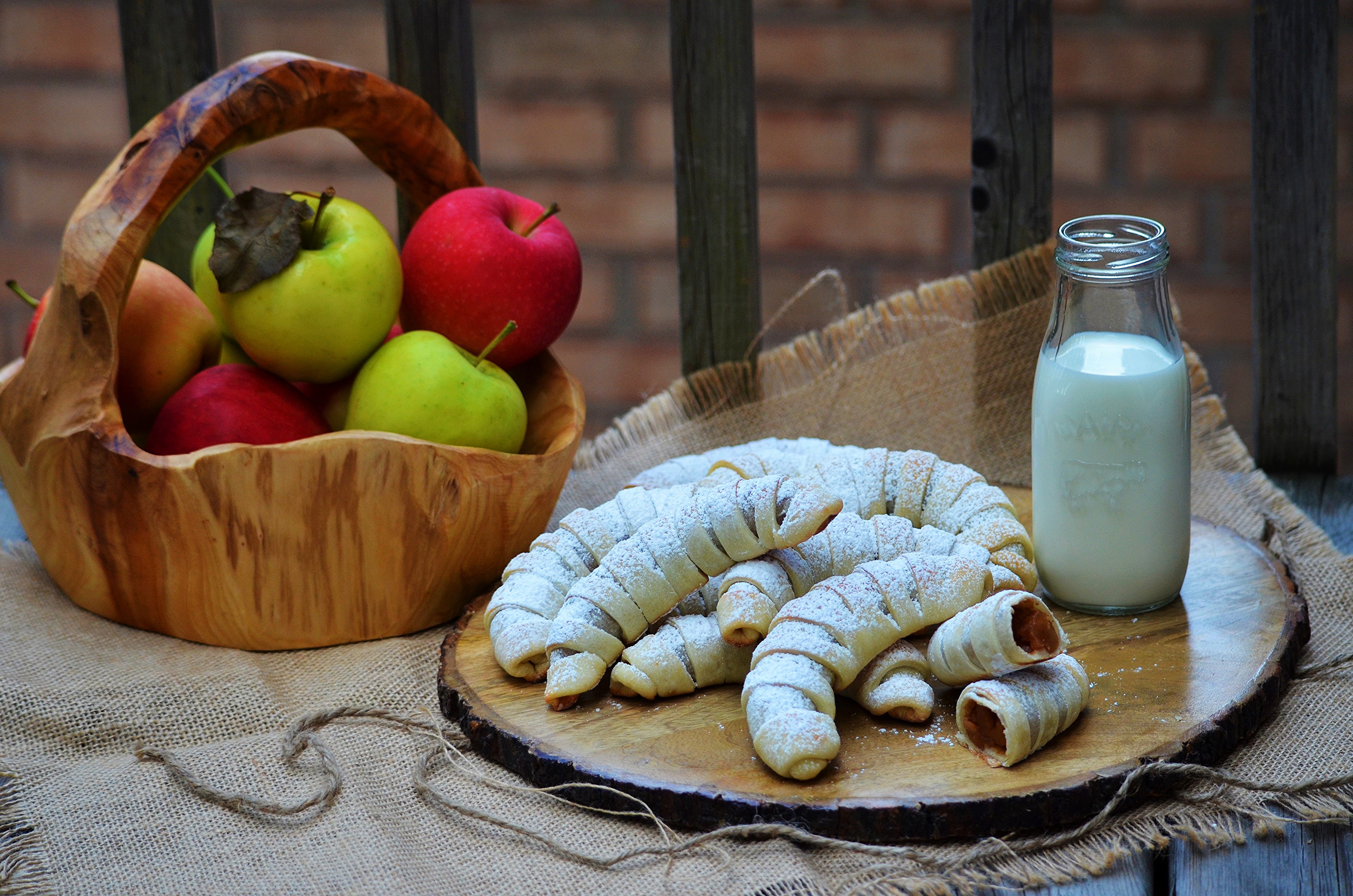 Apples, Pastries, and Milk in a Rustic Setting HD Wallpaper