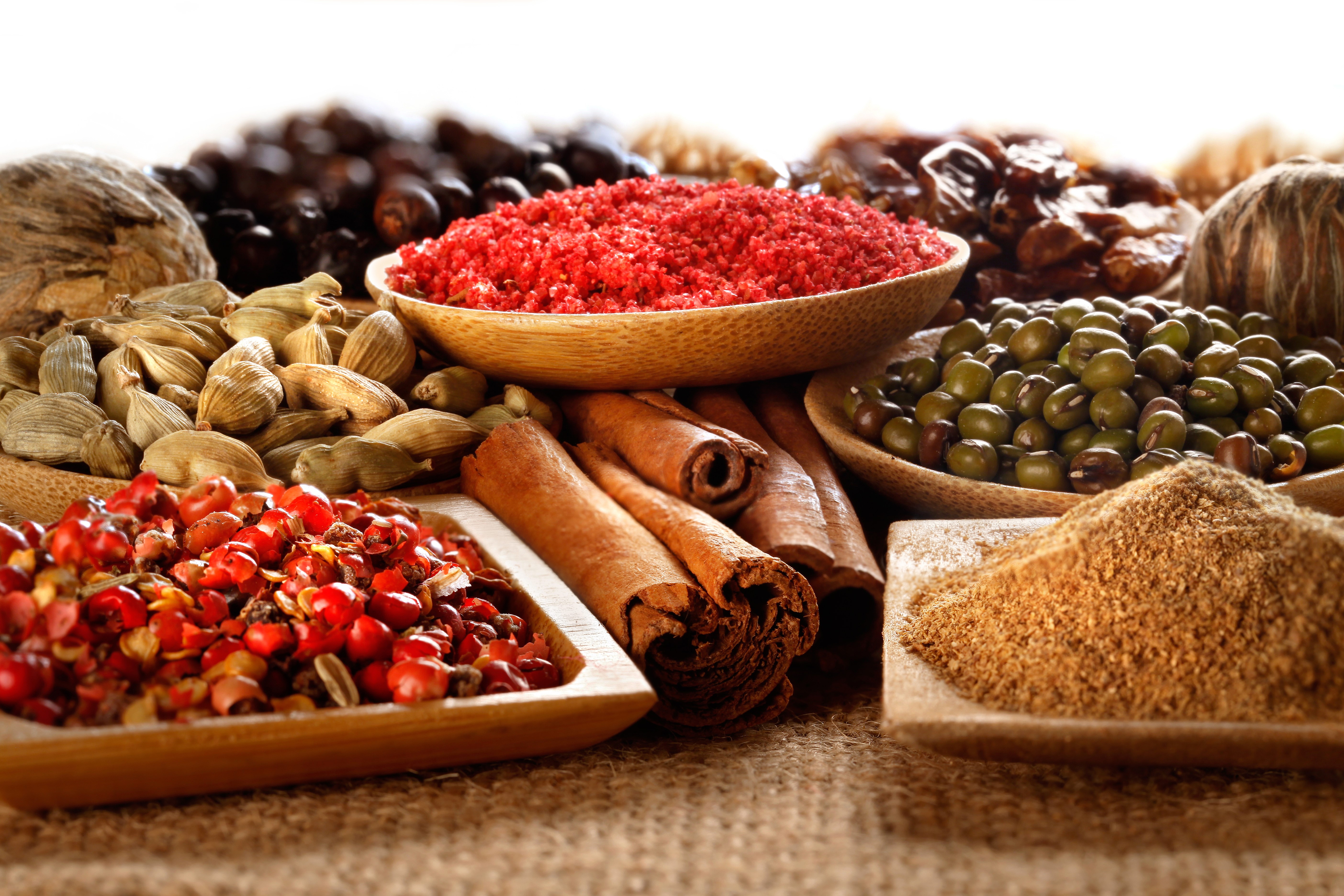 Assortment of Spices: Cinnamon, Cardamom, Mung Beans, and More HD Wallpaper