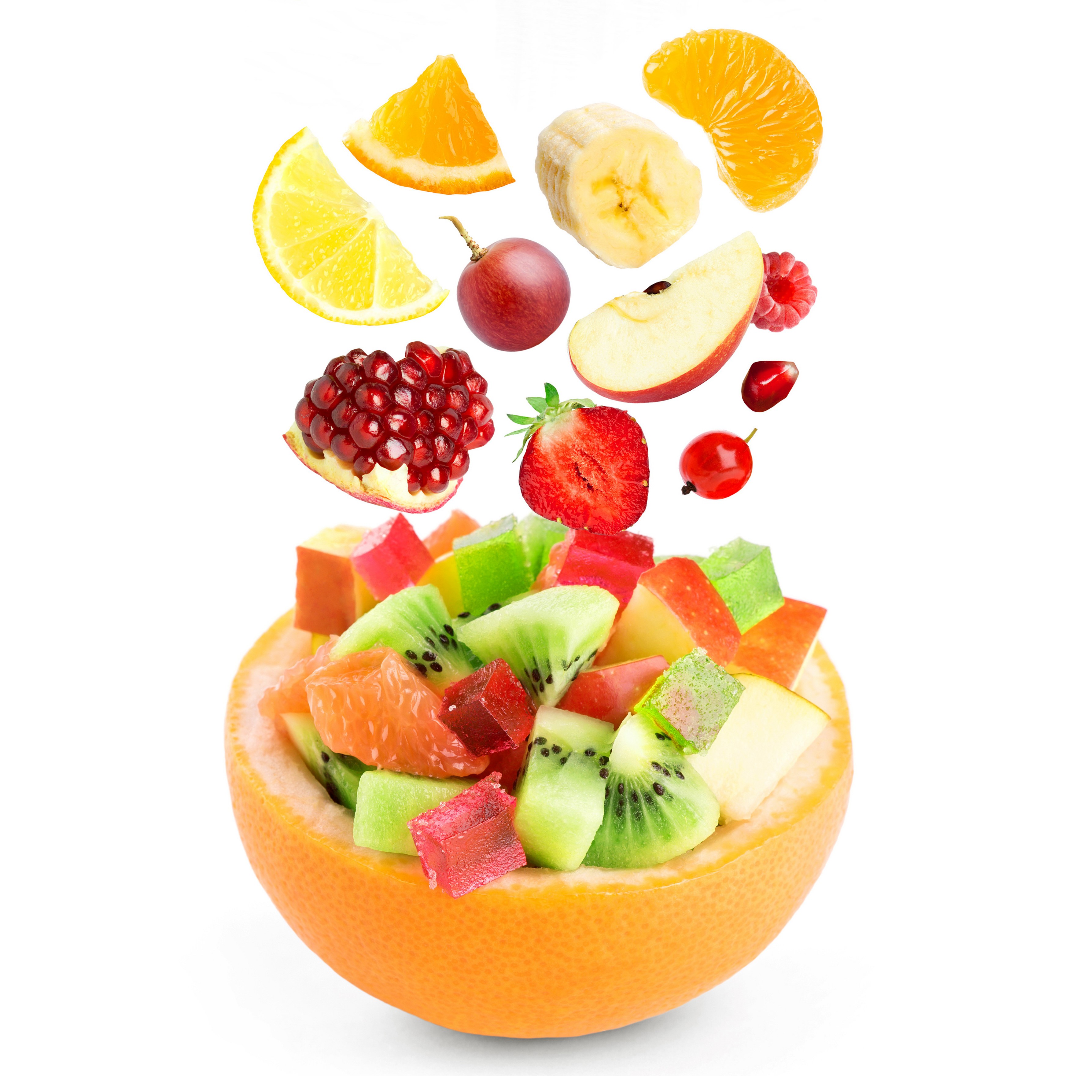 Fruit salad in a grapefruit bowl with falling fruits HD Wallpaper