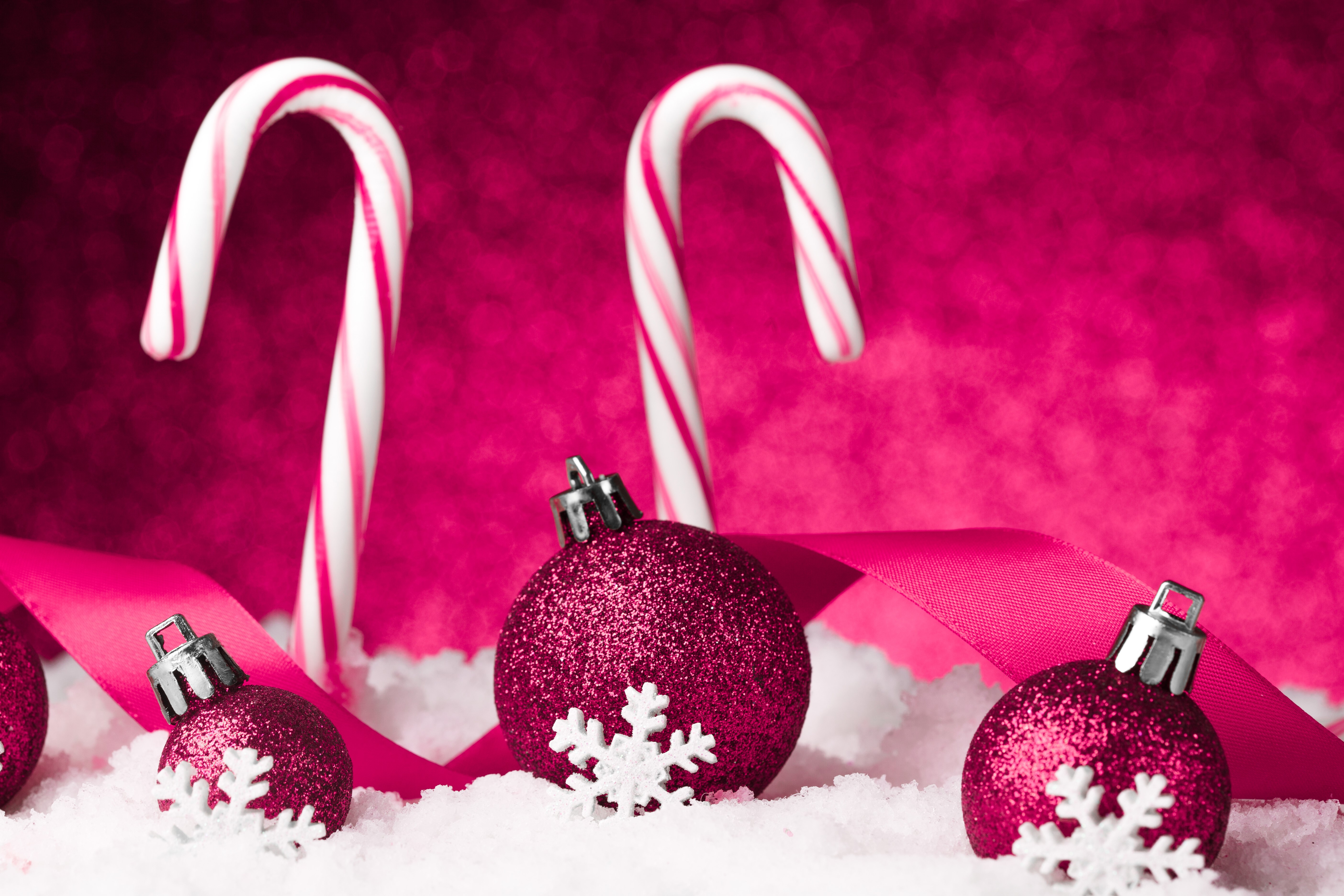 Christmas candy canes and ornaments in snow HD Wallpaper
