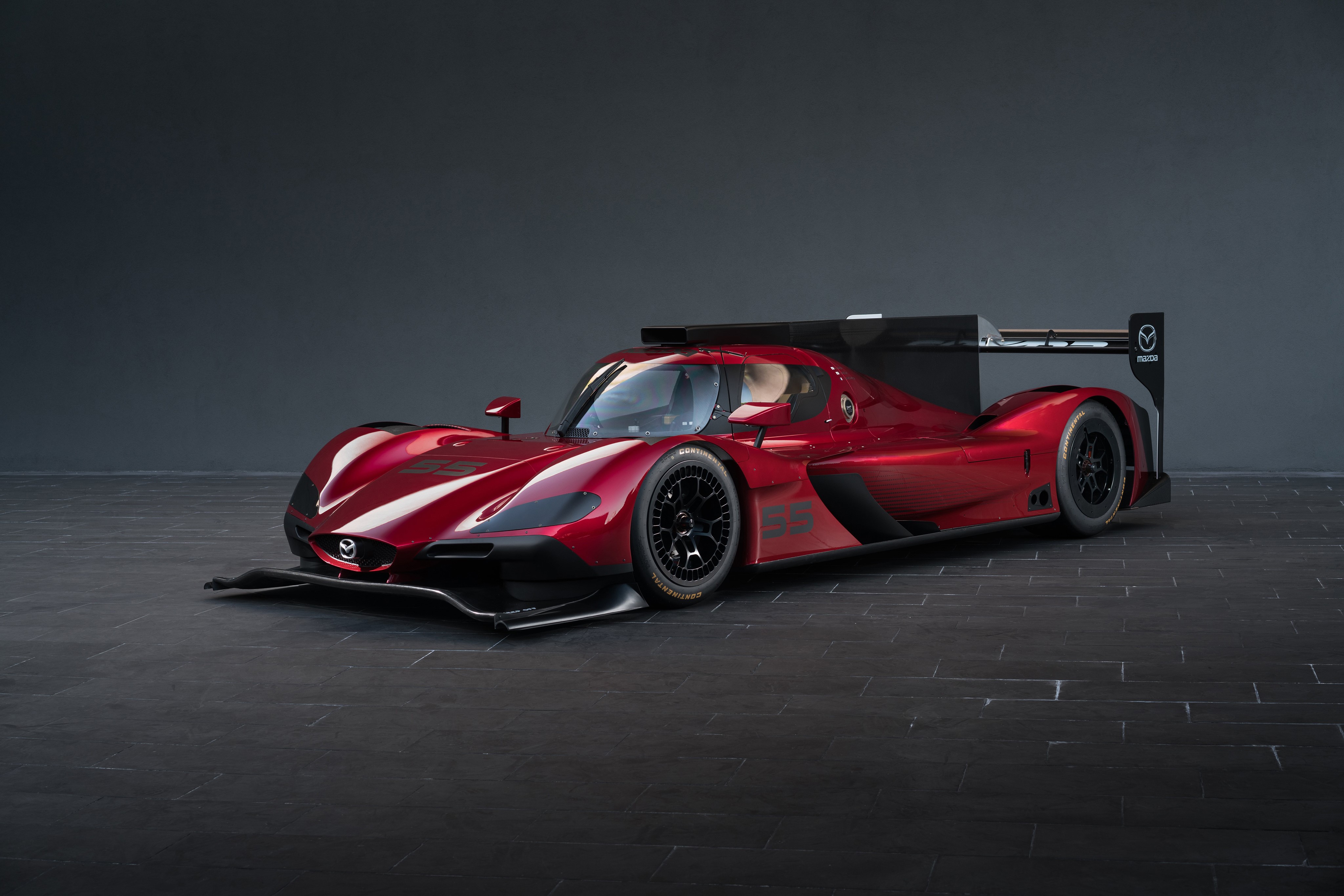 Mazda RT24-P race car in wine metallic color HD Wallpaper