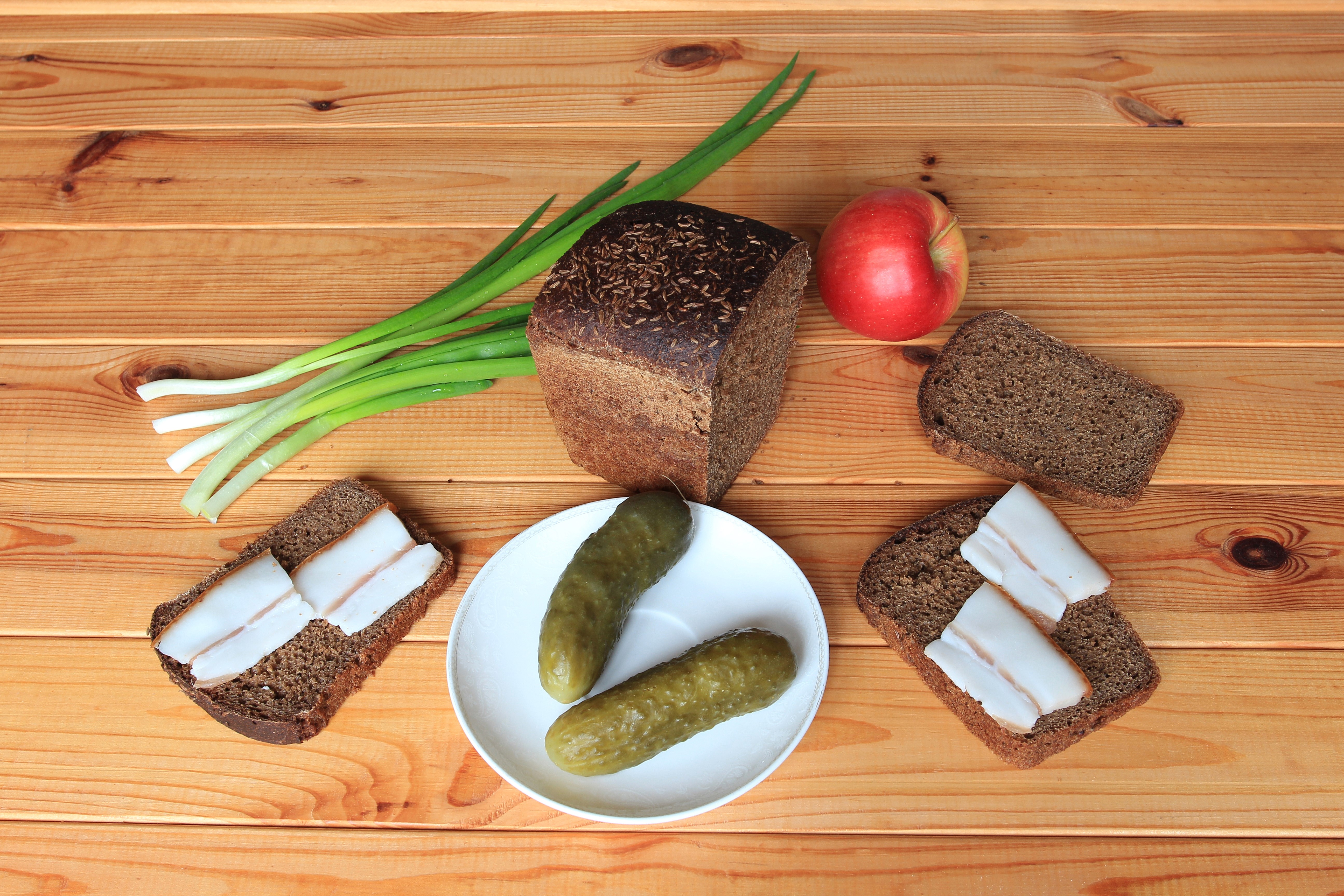 Bread, Cucumbers, Salo, Apple, and Green Onions on Wood HD Wallpaper