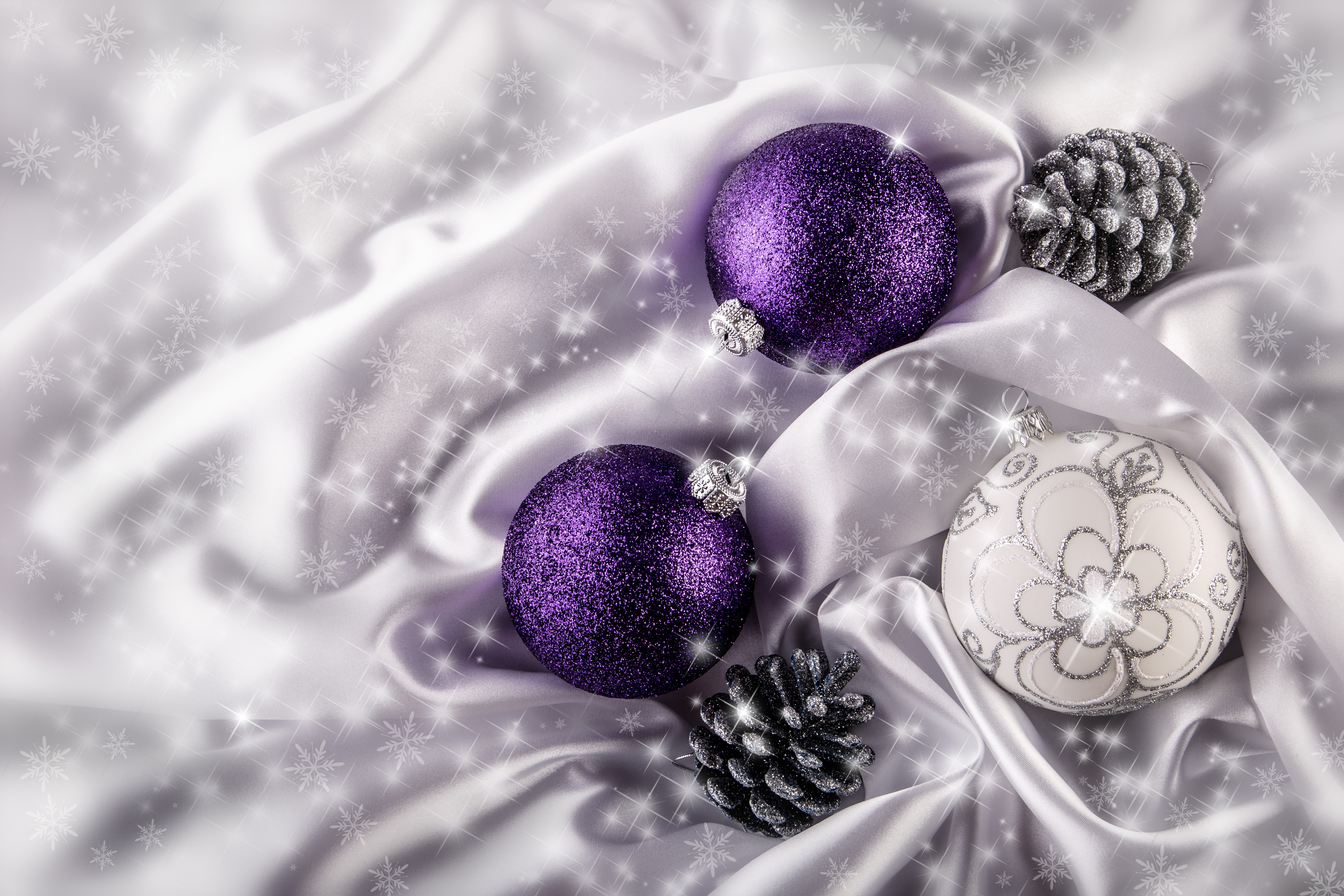 Christmas ornaments and pine cones on satin HD Wallpaper