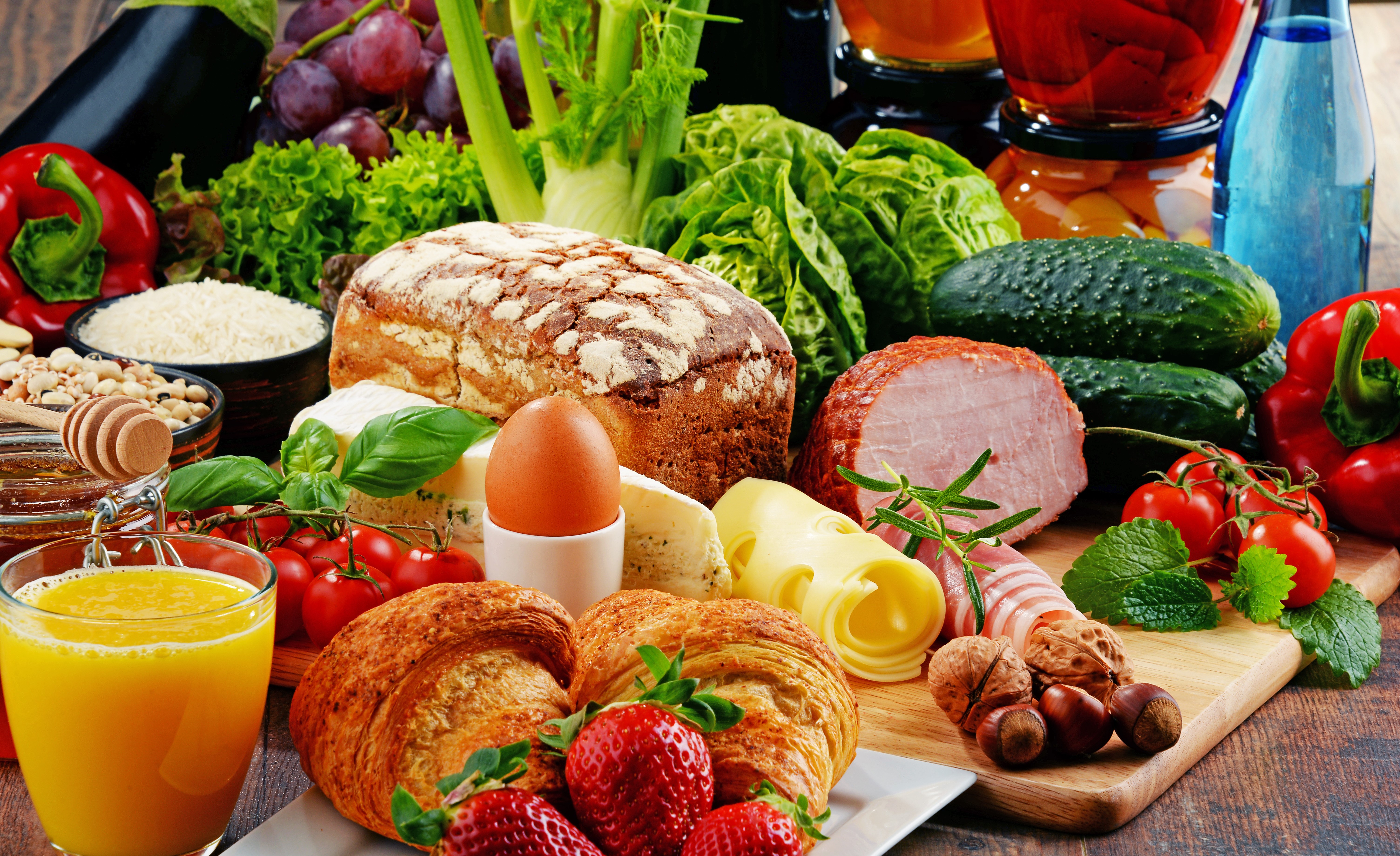 Still-life of breakfast with juice, bread, ham, cheese, and fruits HD Wallpaper