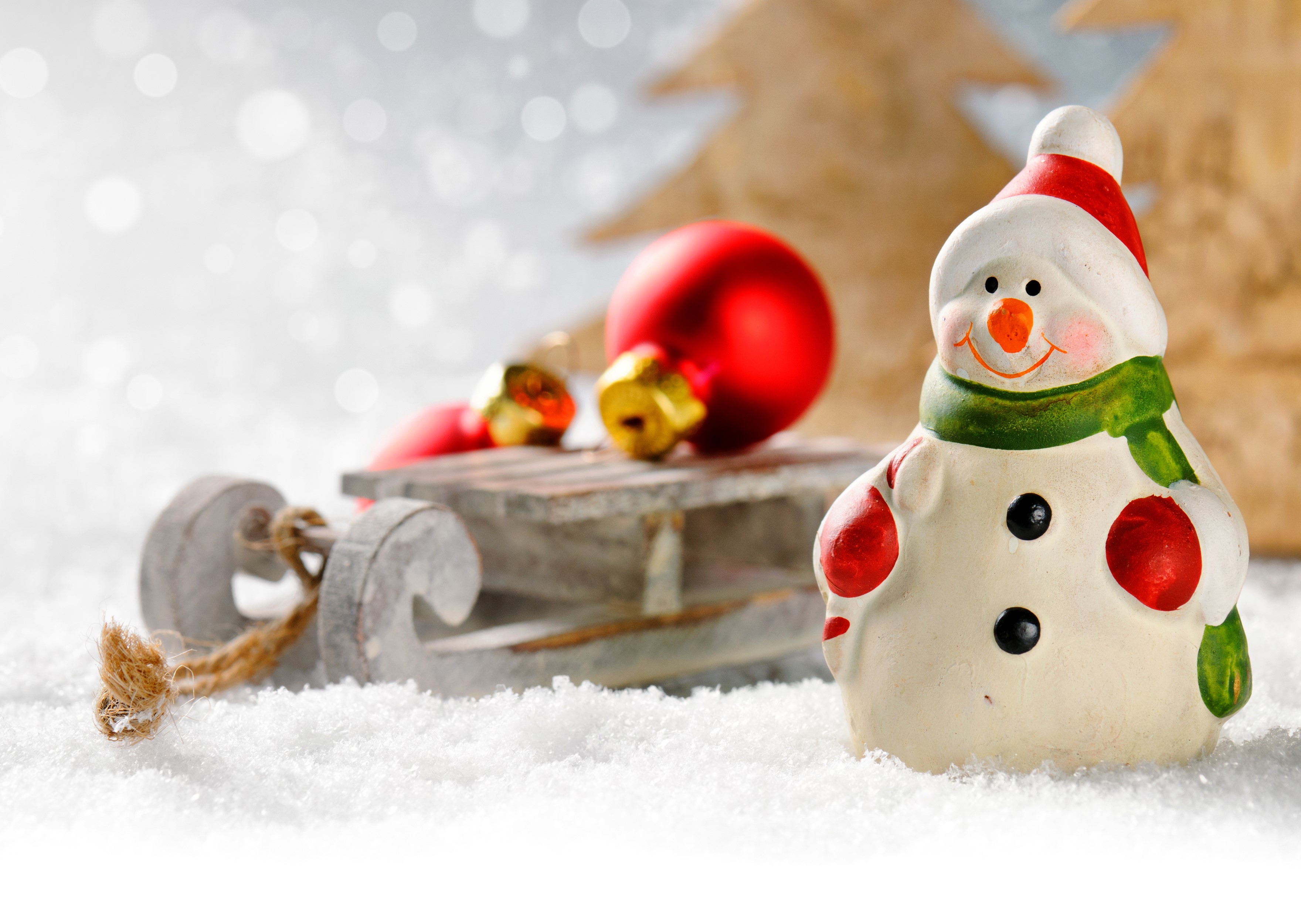 Christmas snowman with sled and ornaments in snow HD Wallpaper