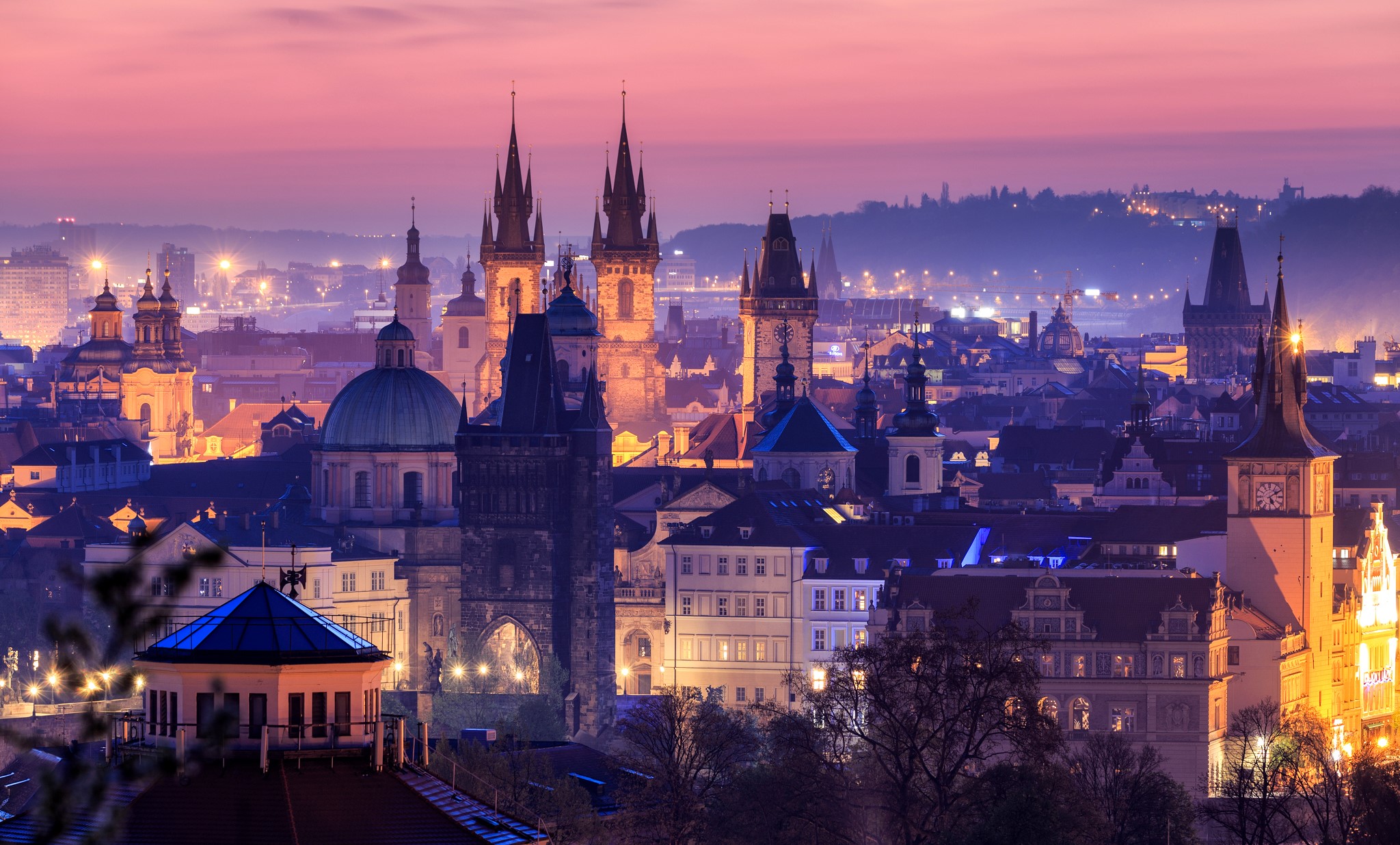 Prague skyline with historic towers at twilight HD Wallpaper