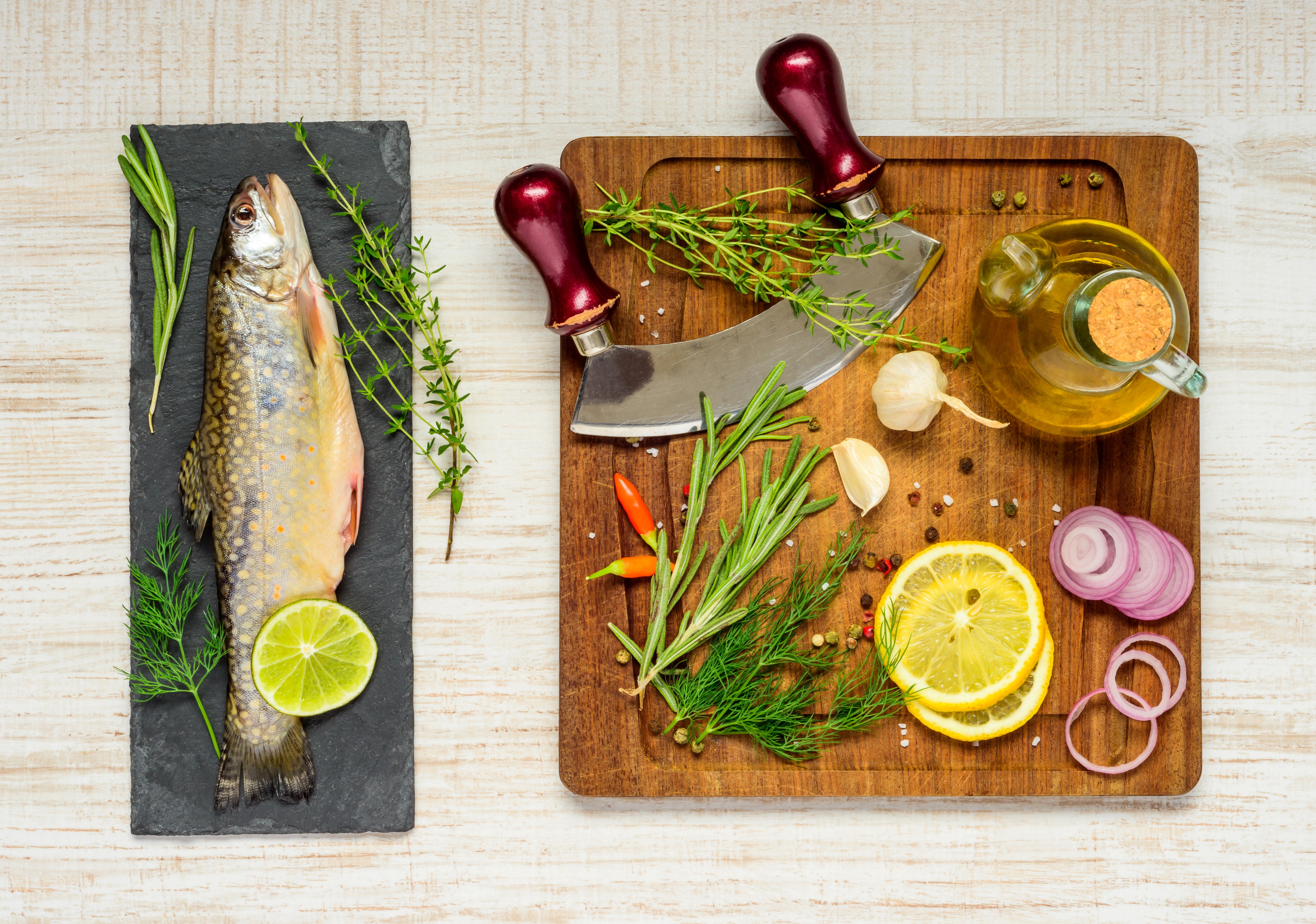 Fish with Lemons, Dill, Onion, and Spices on Cutting Board HD Wallpaper