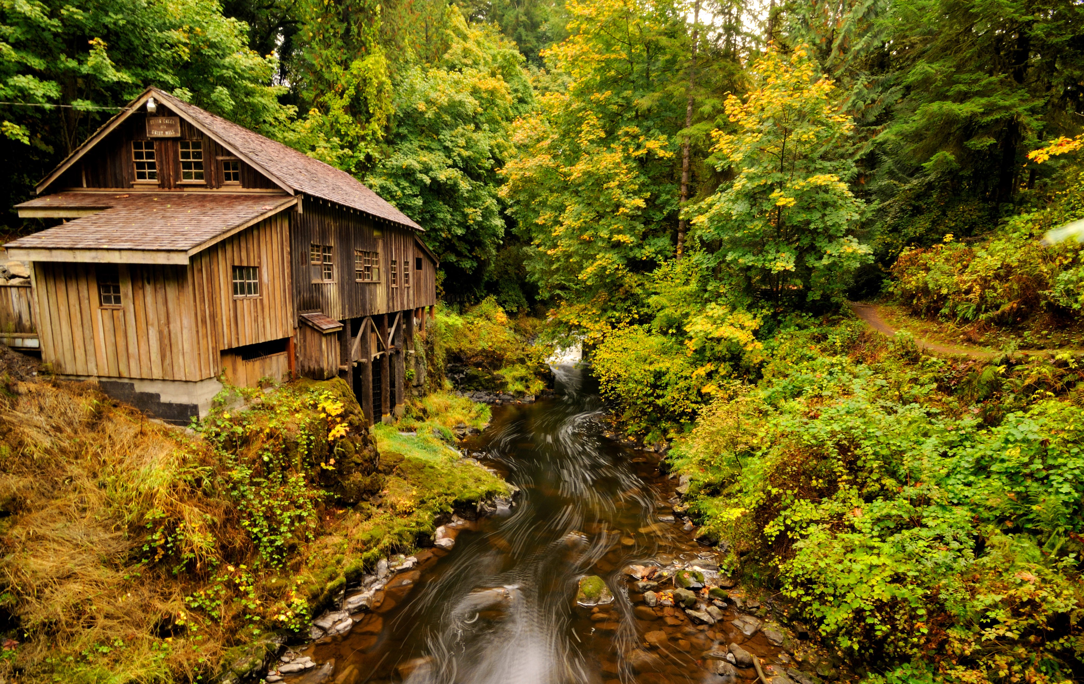 Wooden watermill by a river in a forest HD Wallpaper