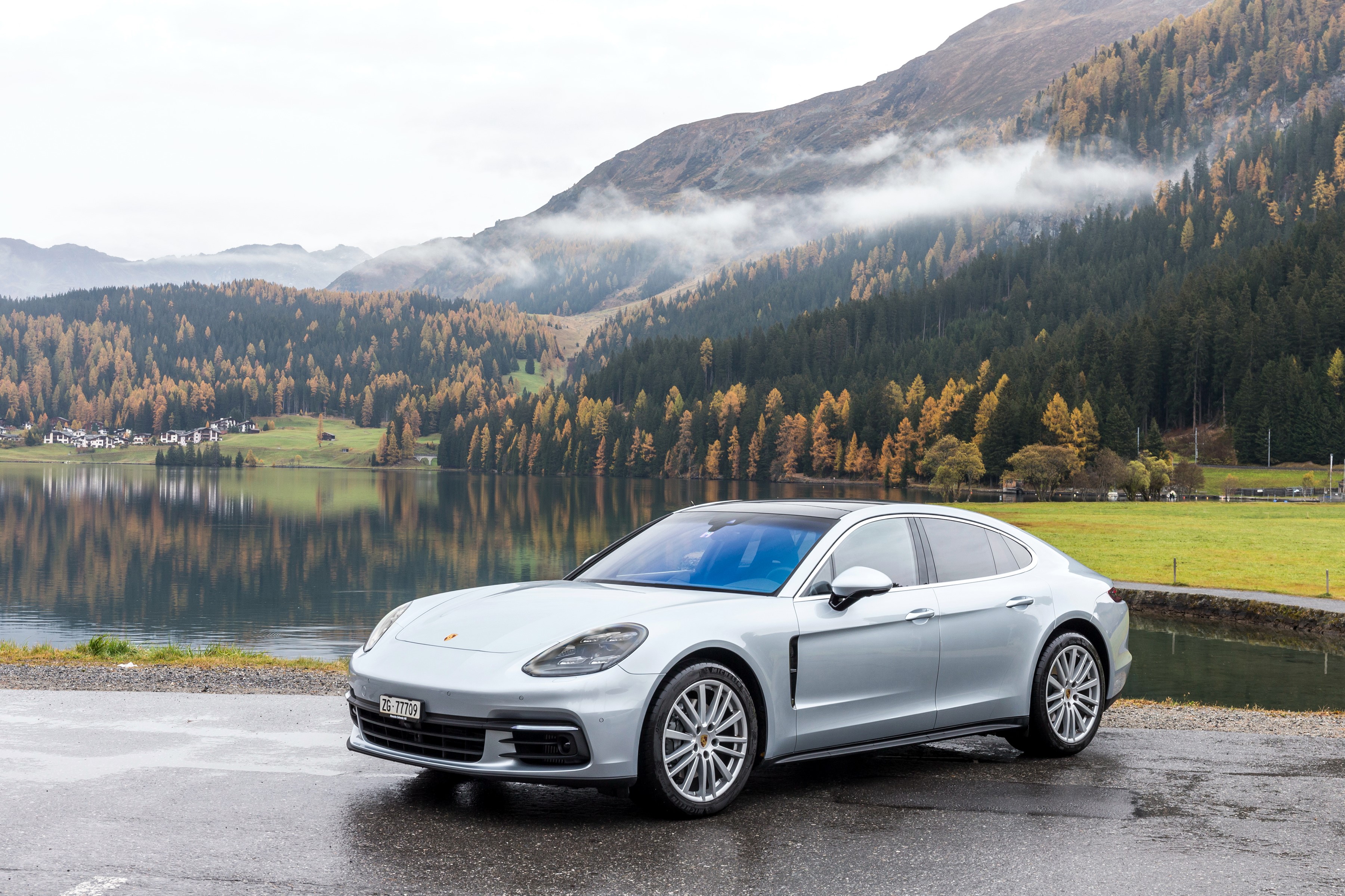Silver Porsche Panamera 4S by a lake with mountains HD Wallpaper