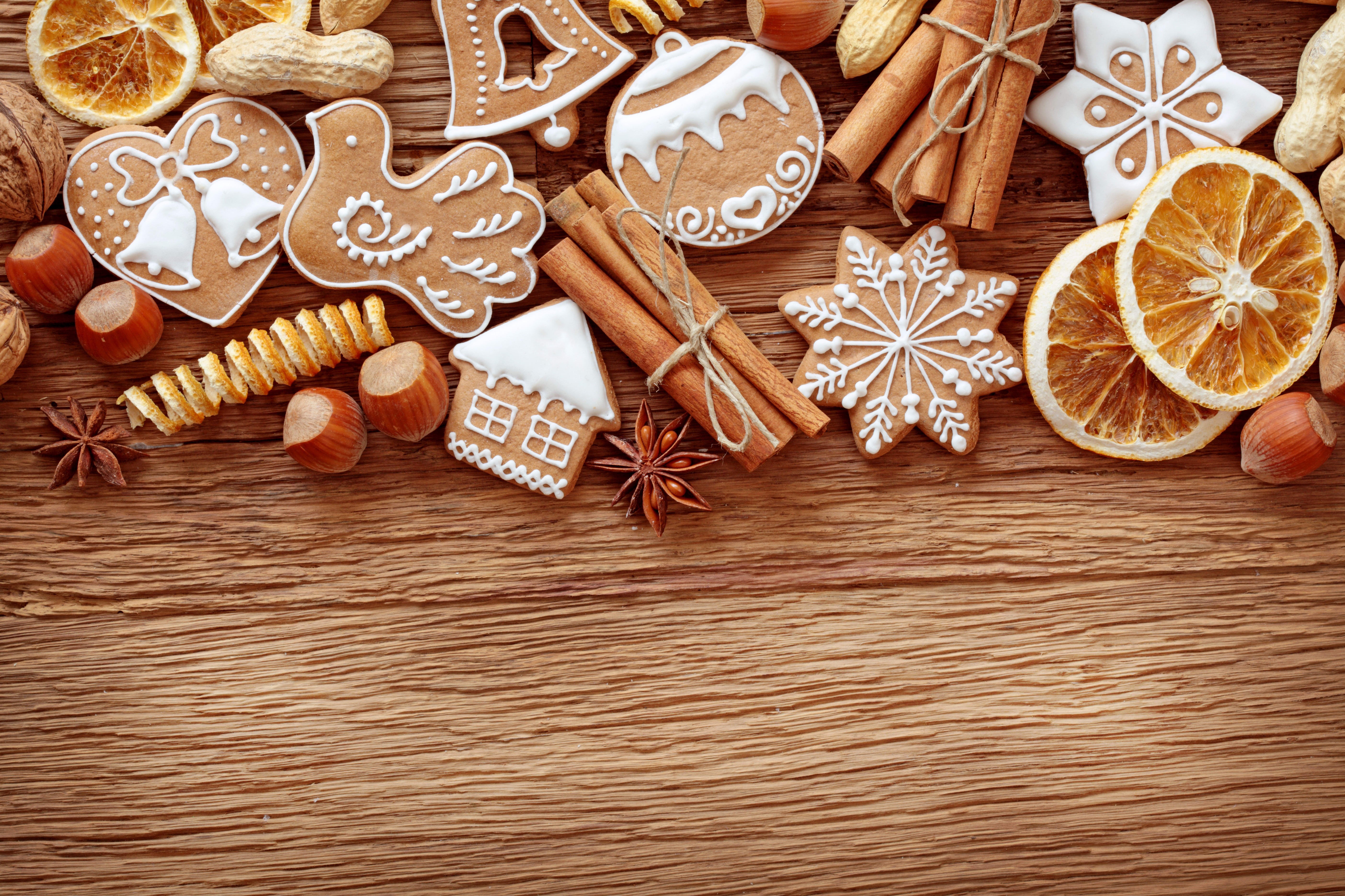 Christmas cookies with cinnamon and nuts on wood HD Wallpaper
