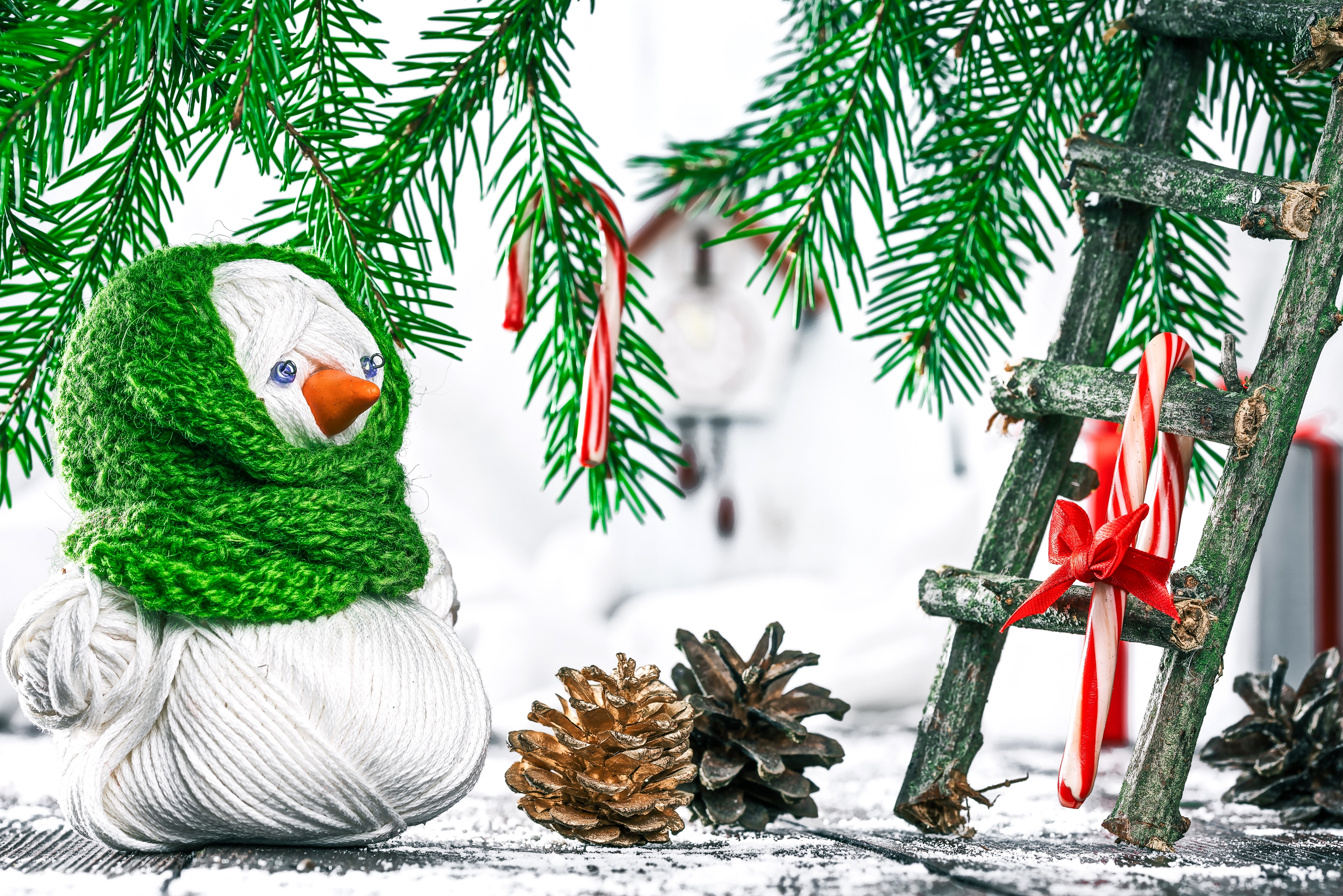 Christmas snowman with pine cones and candy canes HD Wallpaper
