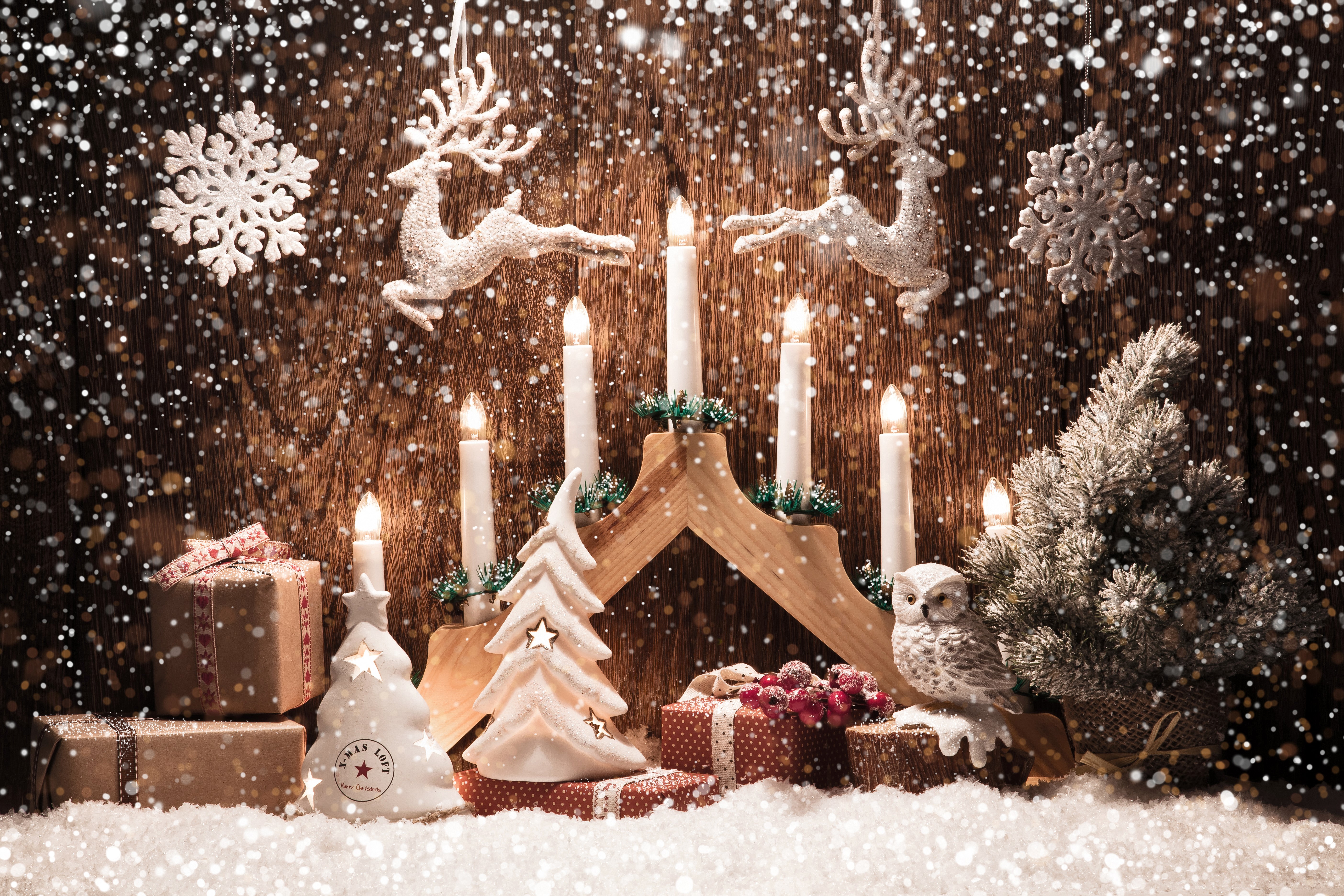 Christmas scene with candles, gifts, and deer HD Wallpaper