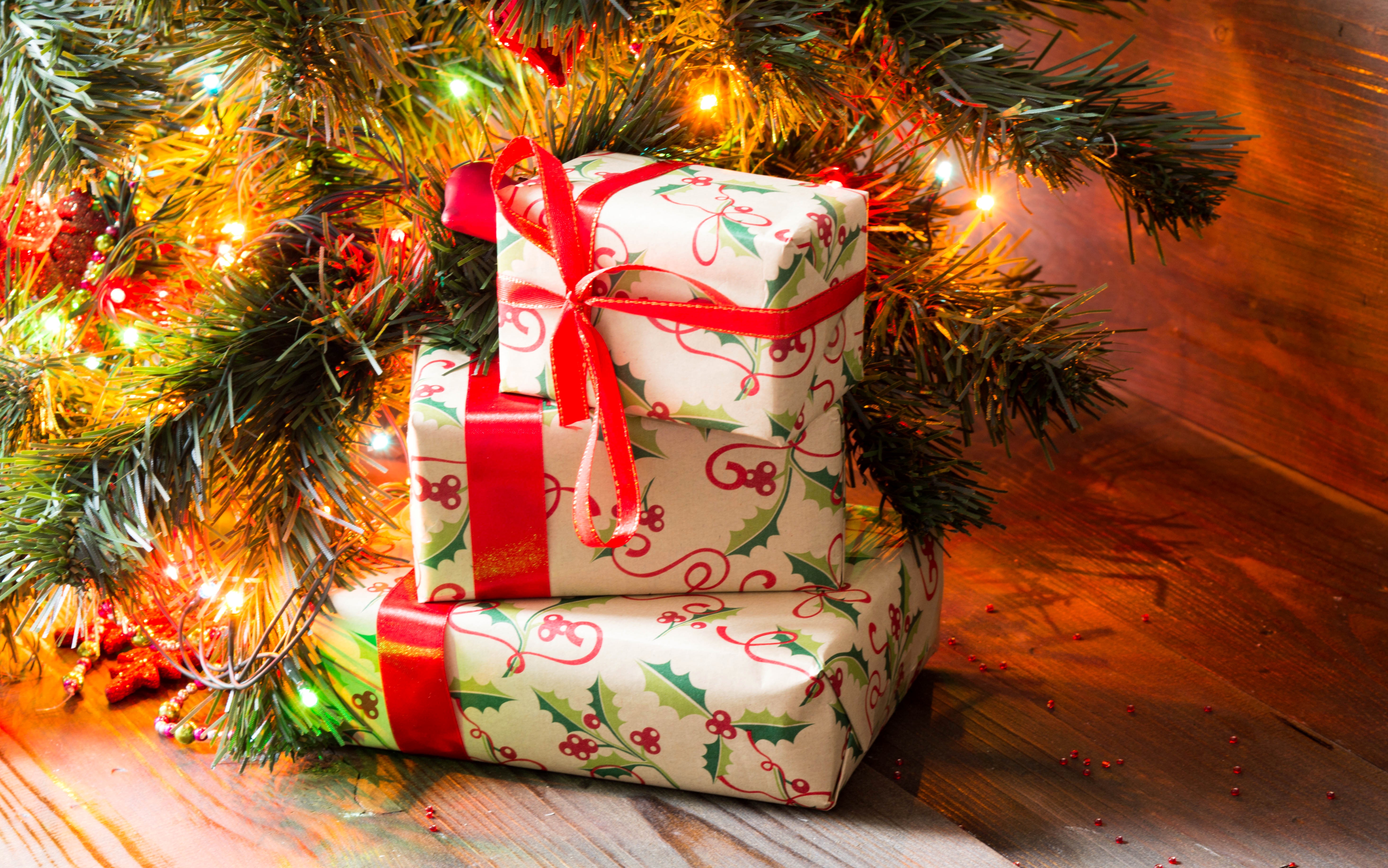 Christmas Gifts under a Tree with Fairy Lights HD Wallpaper
