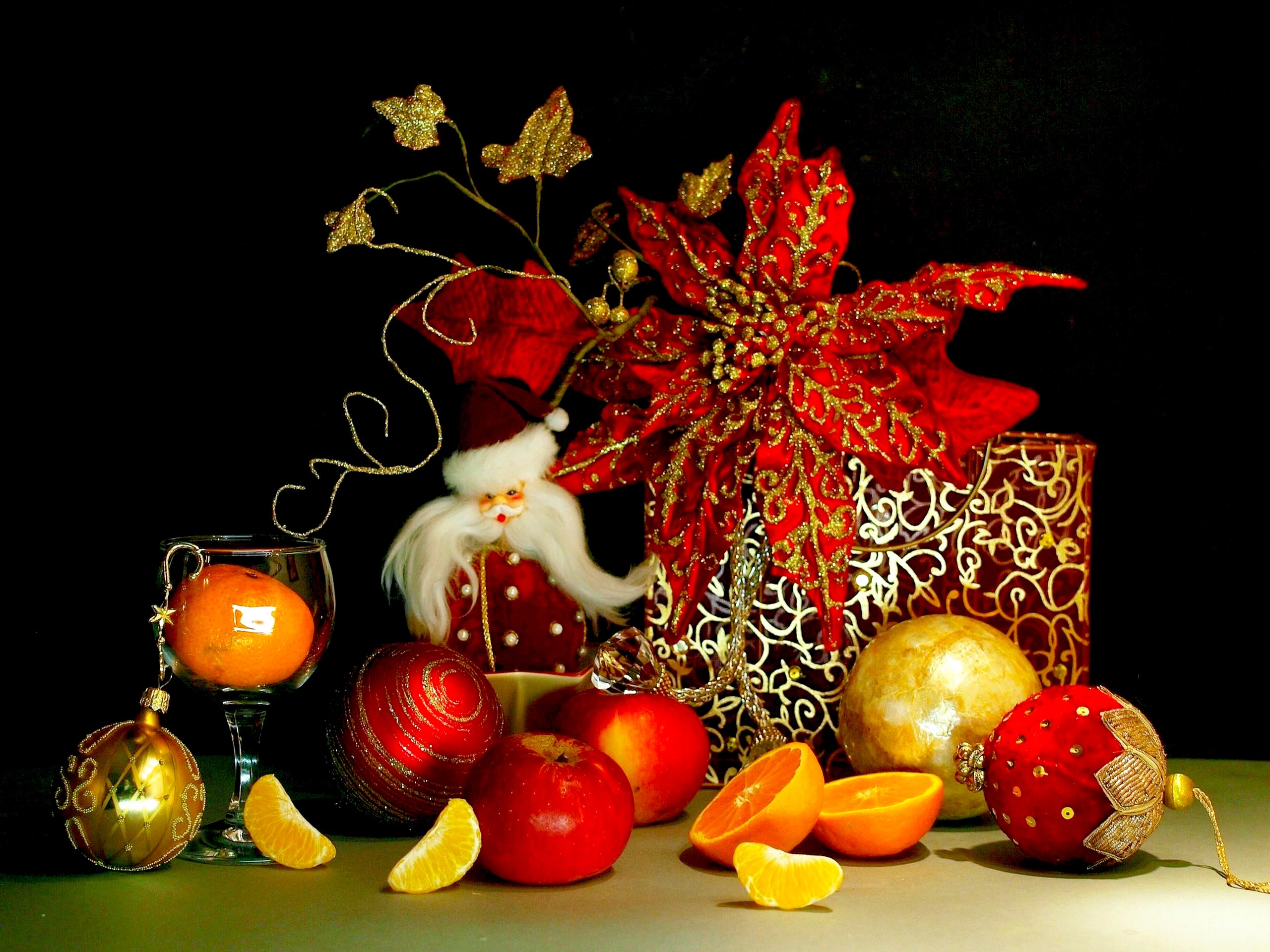 Christmas still life with Santa, ornaments, and fruit HD Wallpaper