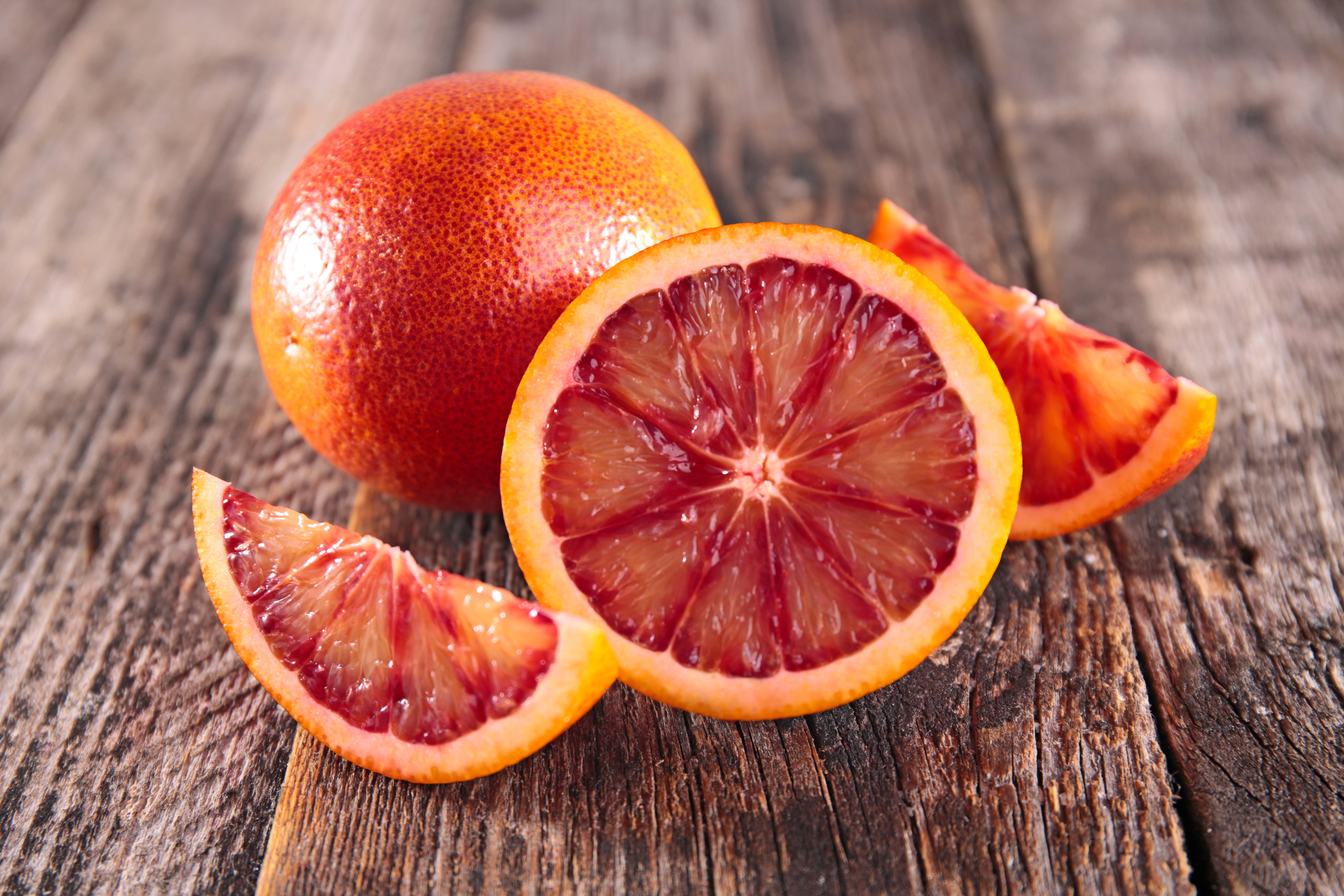 Blood oranges on wooden planks HD Wallpaper