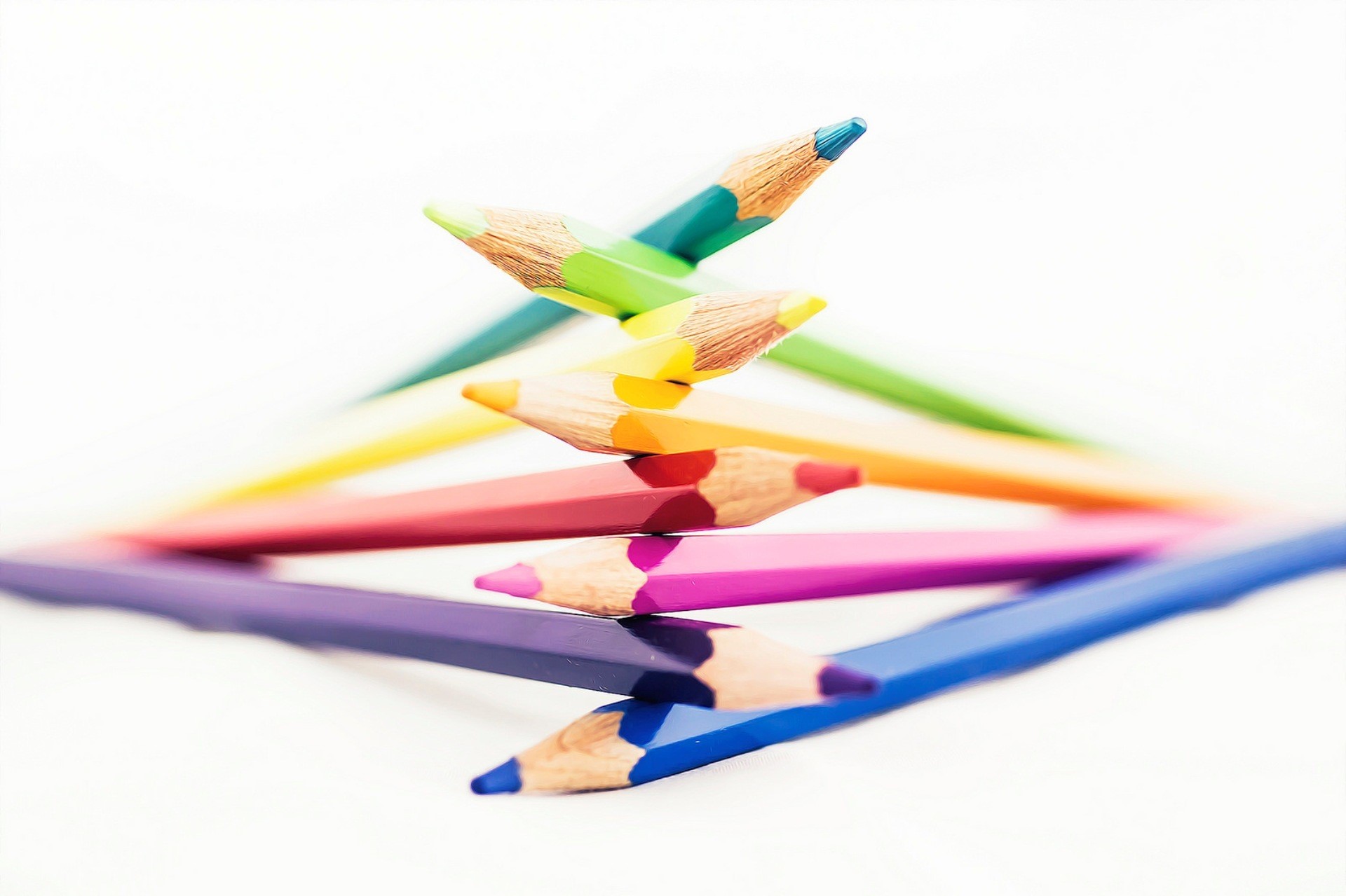 Stack of colorful pencils on a white background HD Wallpaper