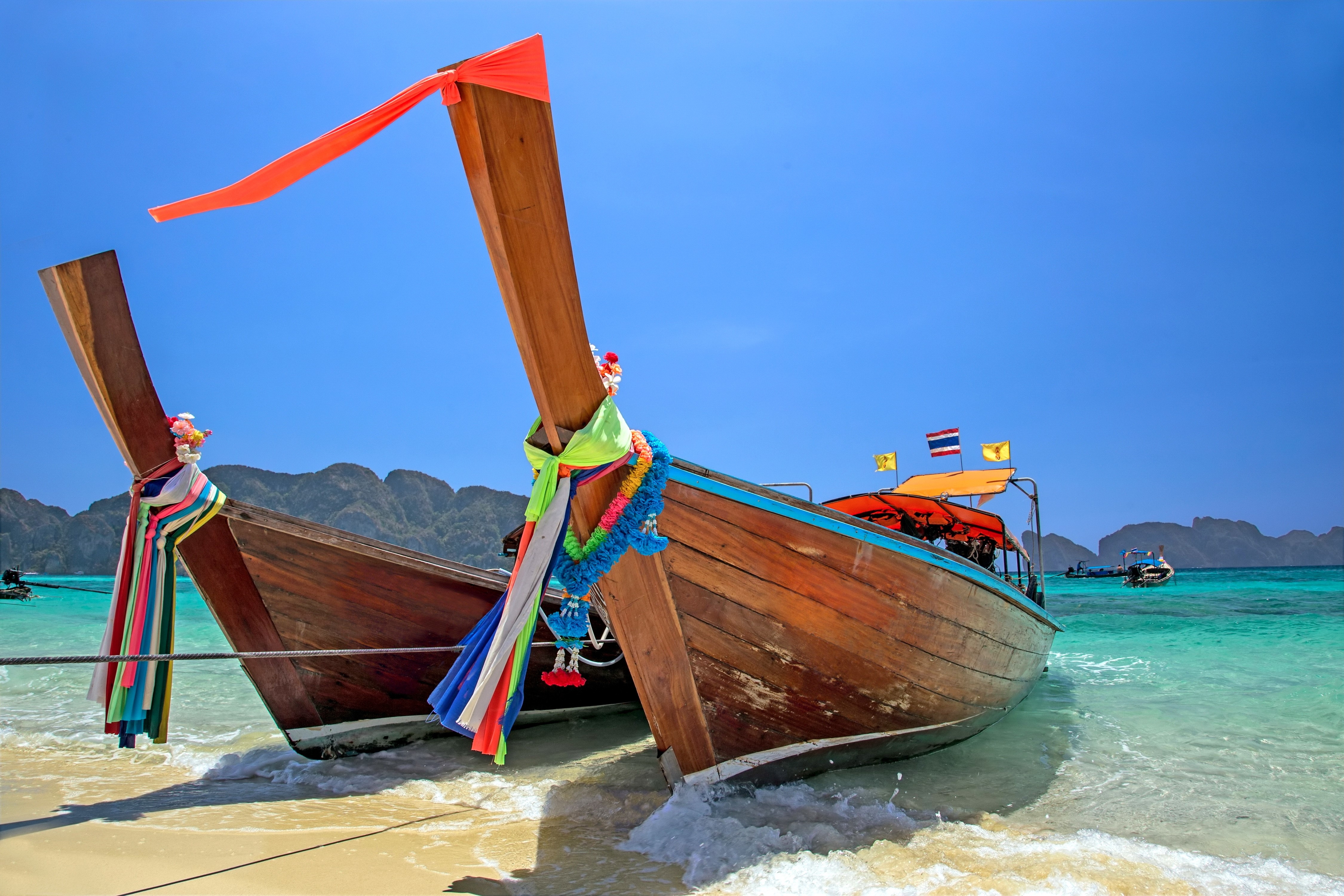 Two wooden boats on a tropical beach HD Wallpaper