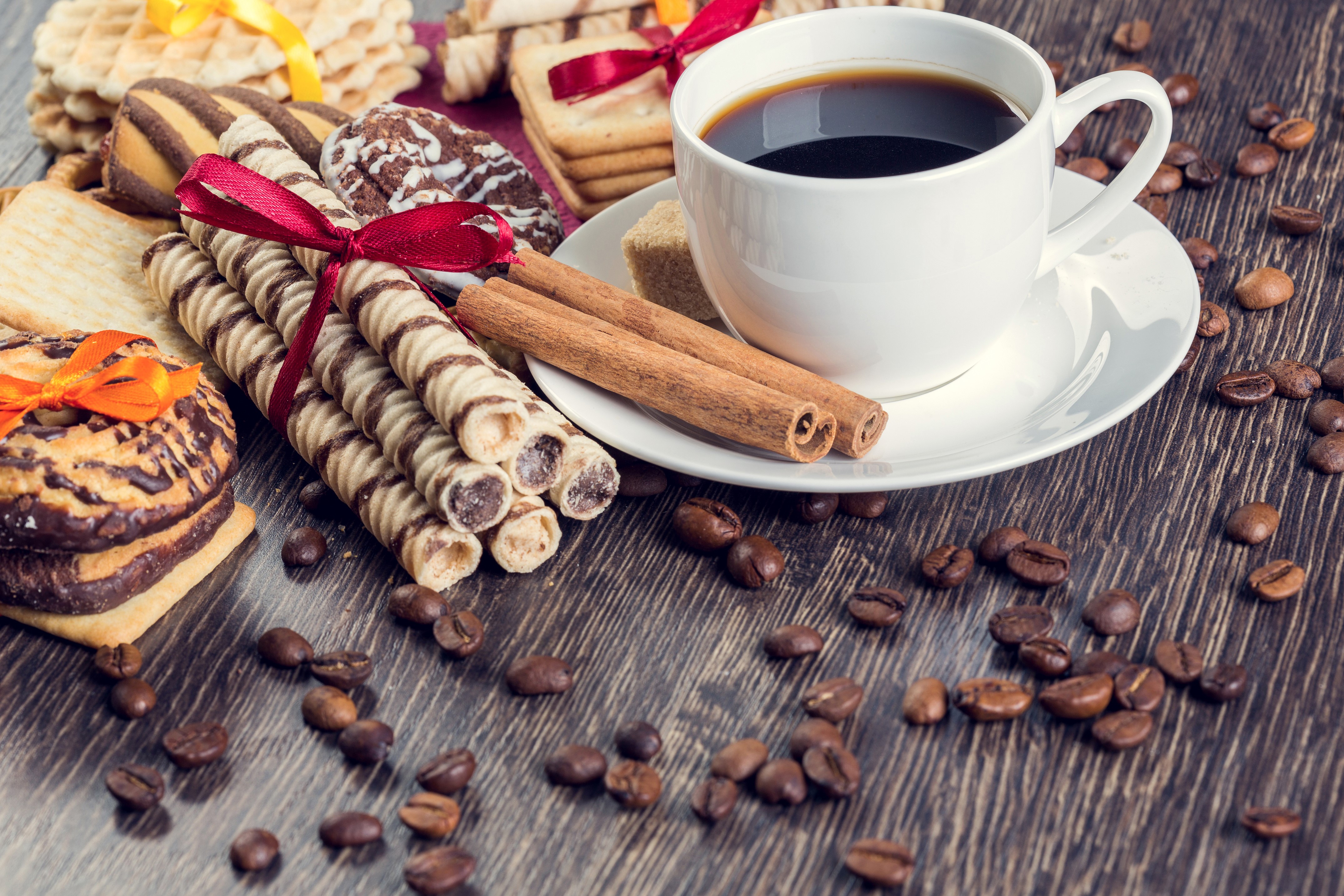 Coffee cup with pastries and cinnamon sticks HD Wallpaper