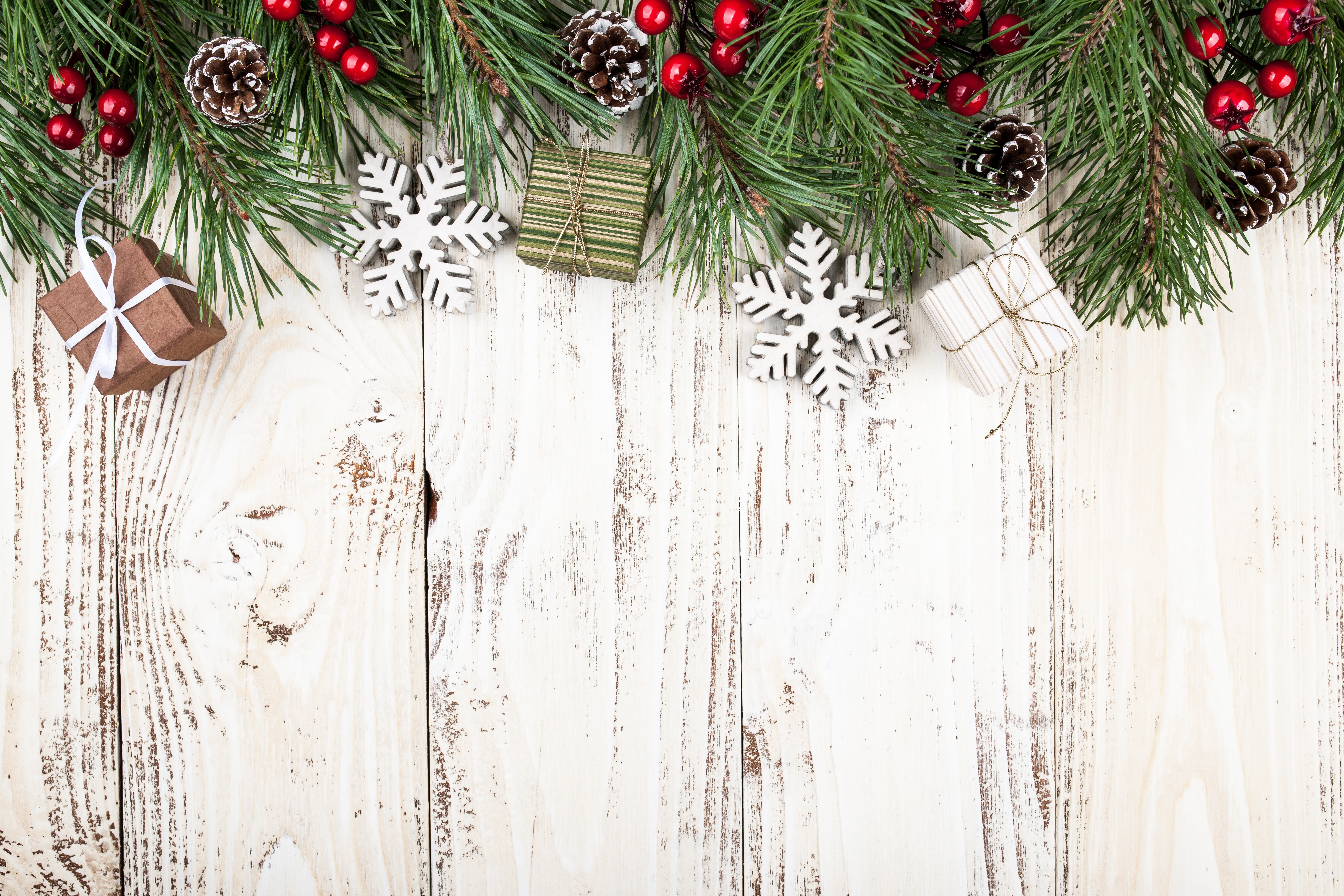 Christmas pine branches with ornaments on wood planks HD Wallpaper
