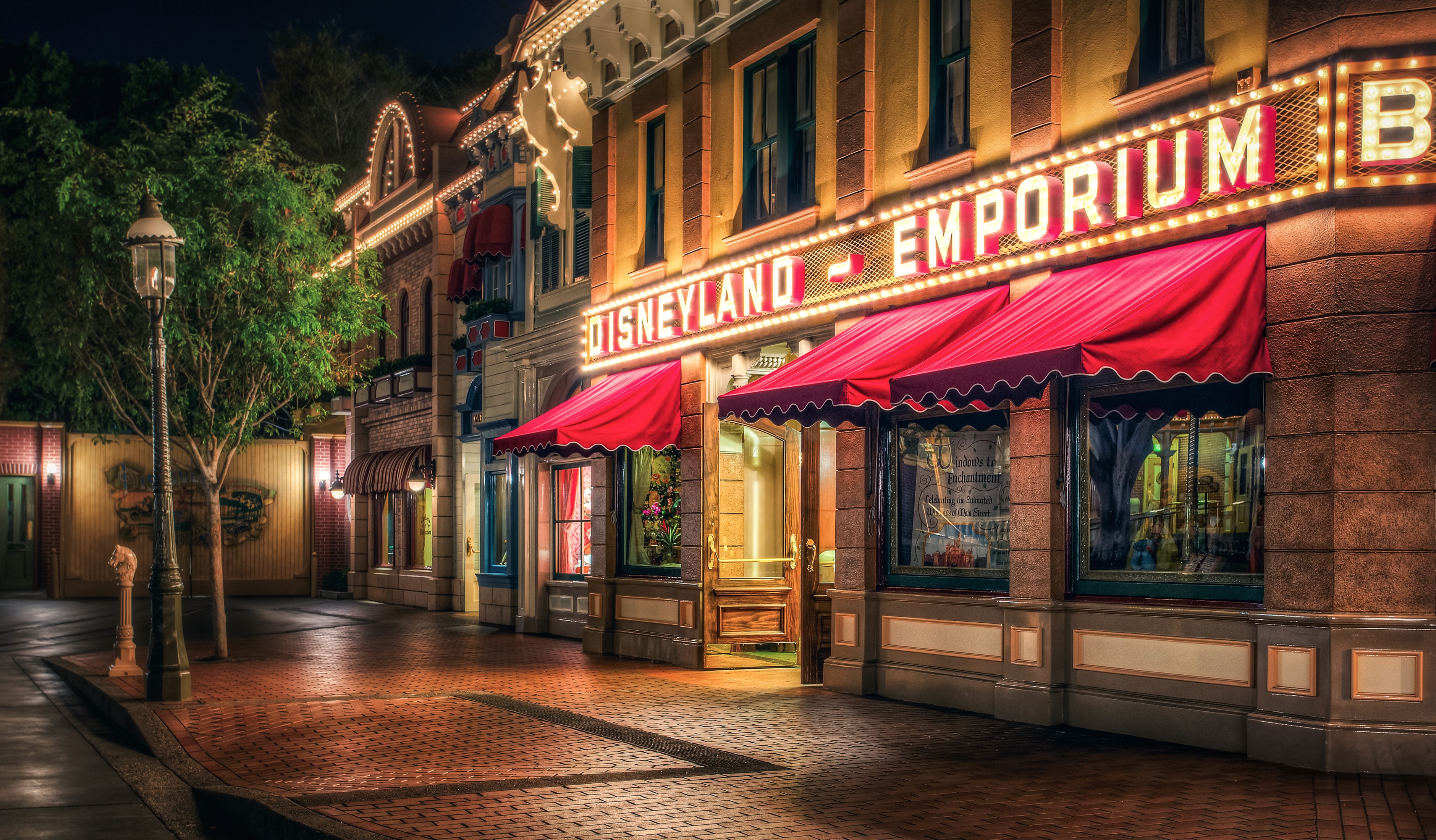 Disneyland Emporium on Main Street at Night HD Wallpaper
