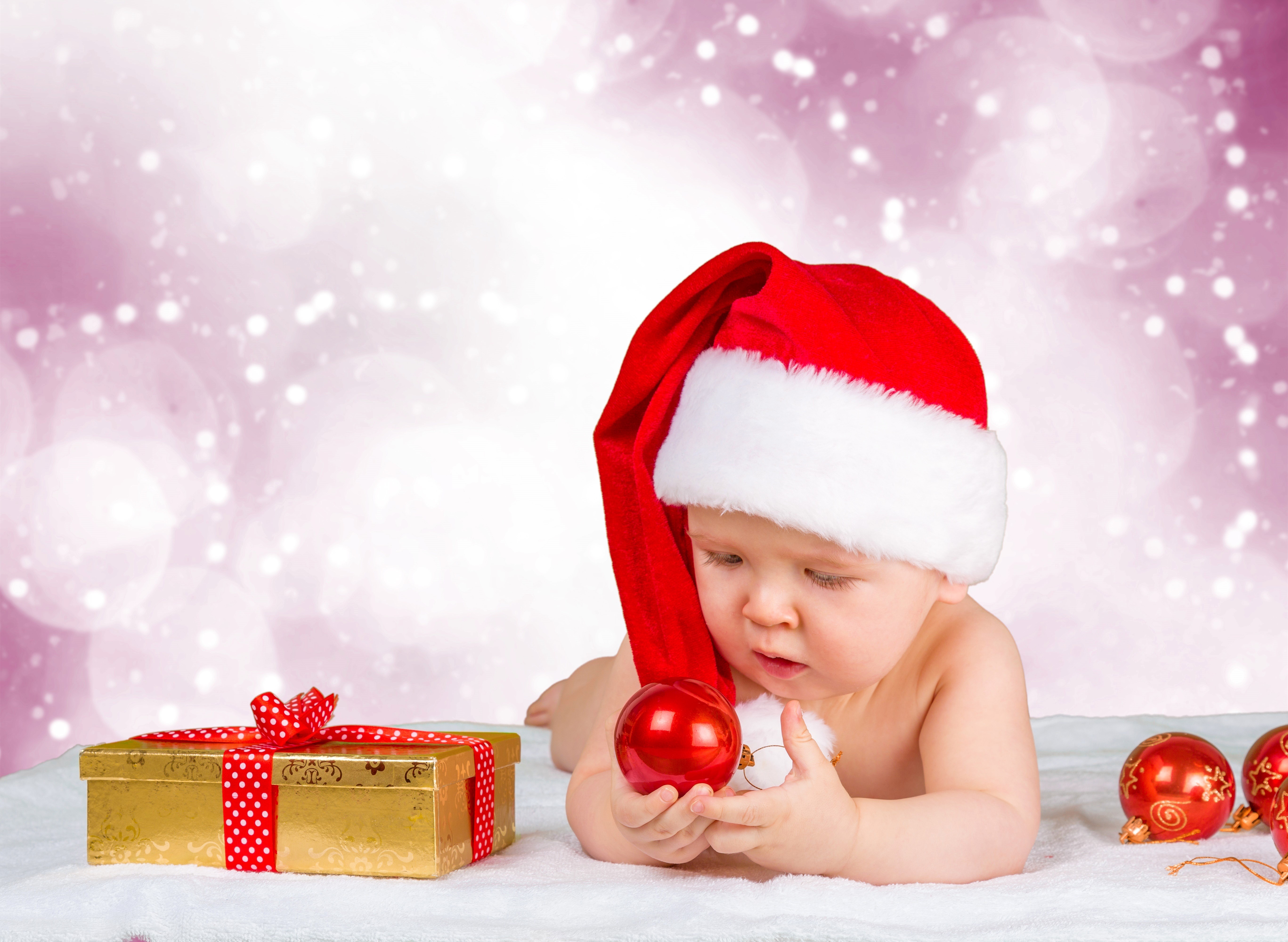 Baby in Santa hat with Christmas gifts and ornaments HD Wallpaper